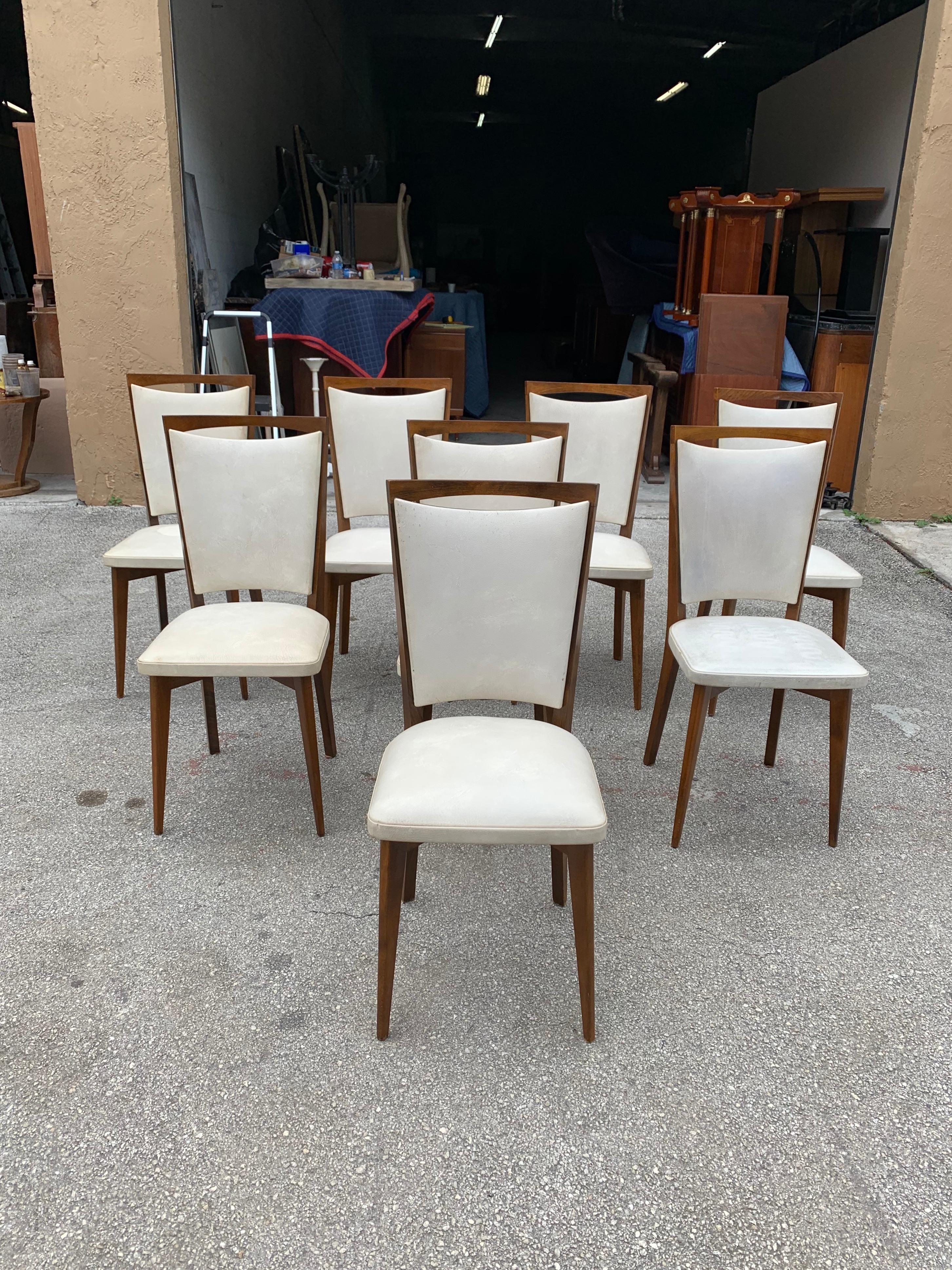 Classic set of 8 French Art Deco dining chairs solid mahogany, the chair frames are in excellent condition. The reupholstery is vinyl recommended to be change for all 8 dining chairs but the vinyl look good, the dining chairs are beautiful, circa