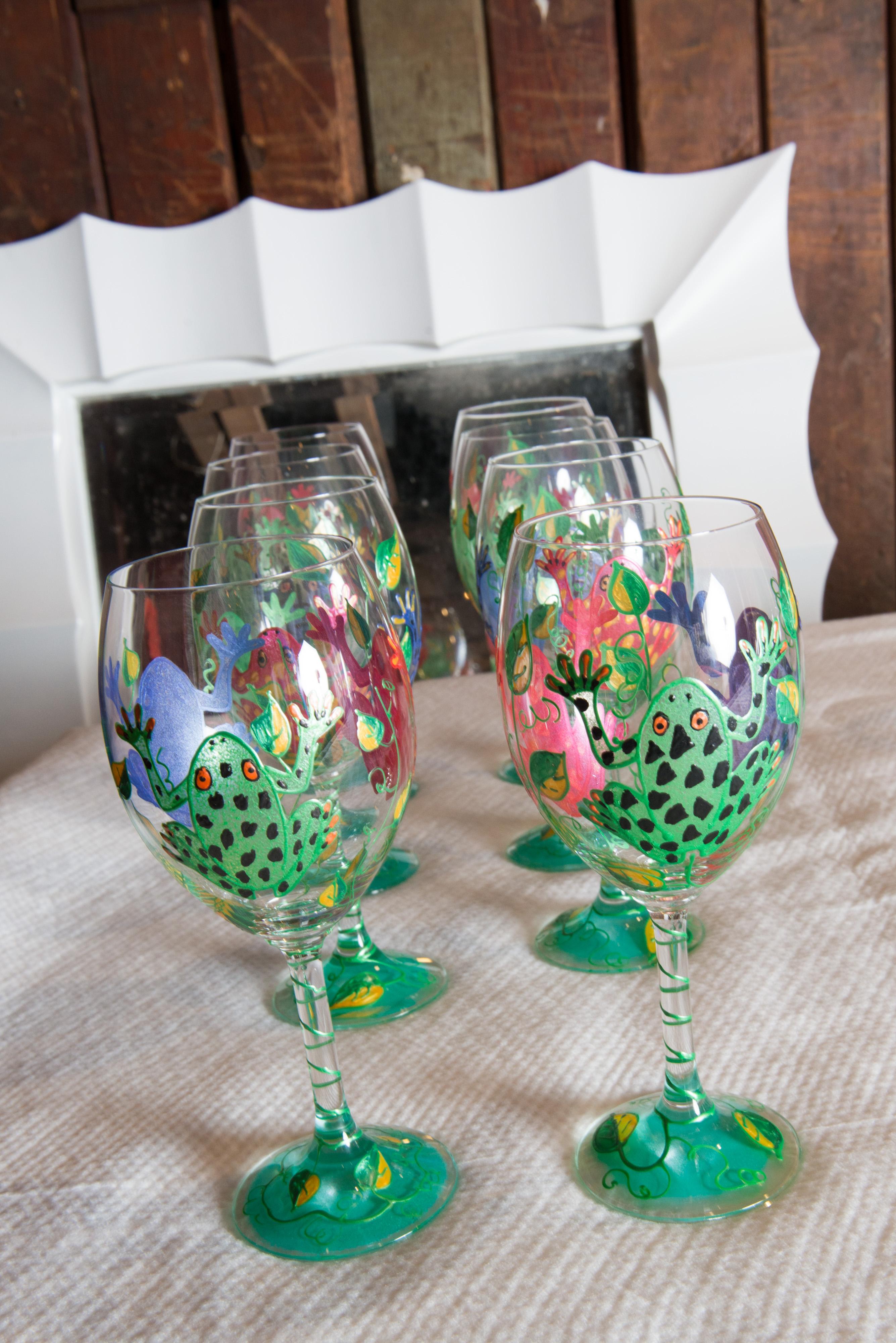 From the Mrs Henry Ford II estate- a whimsical set of colorful frog decorated white wine glasses.
