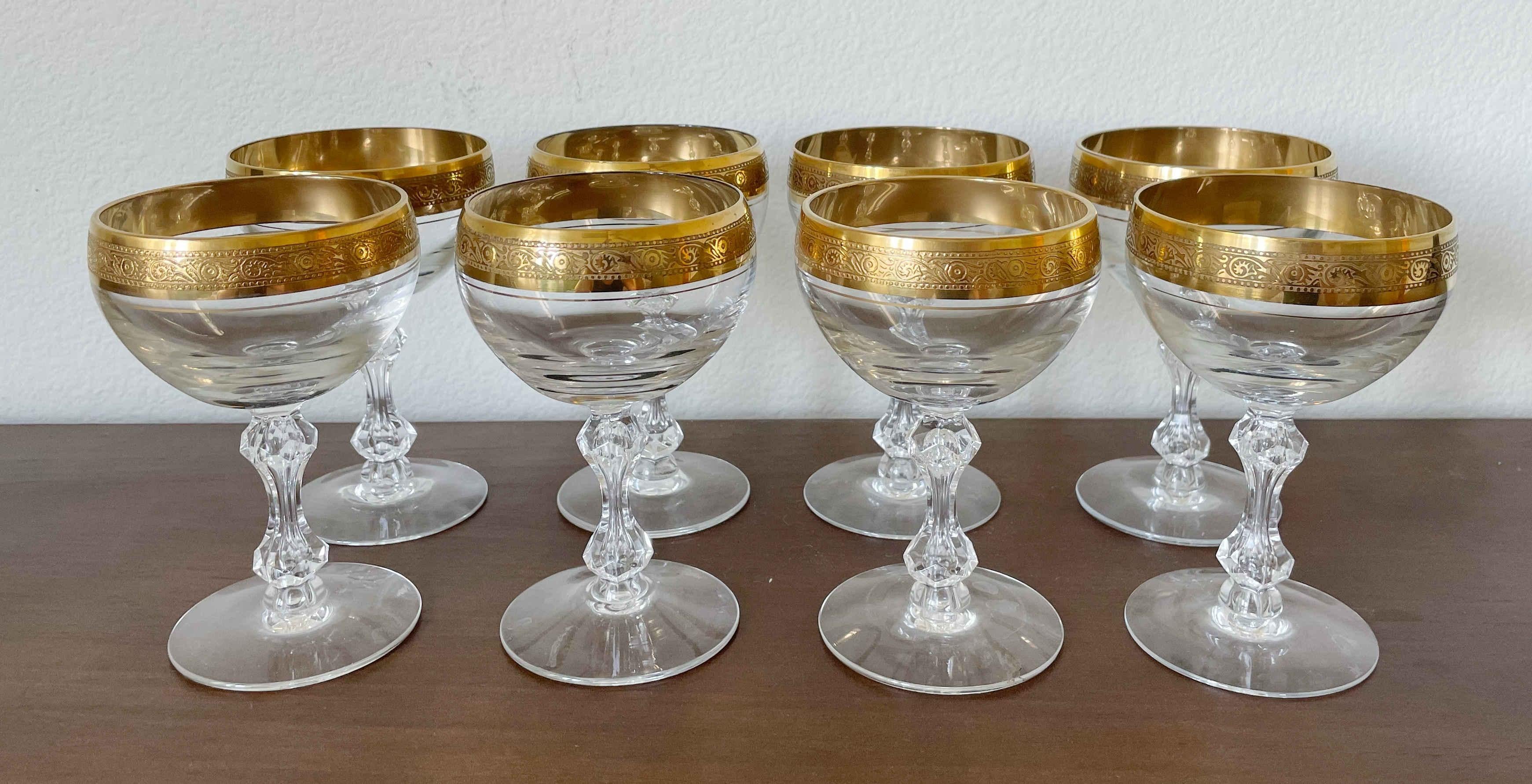 Set of 8 wine glasses with gilt ornament edge and crystal stem / Made in Germany circa 1980s
Measures: diameter 3.5 inches / height 5.5 inches.
1 Set available in stock in Los Angeles, please note 1 glass has a small chip on the base.
 
