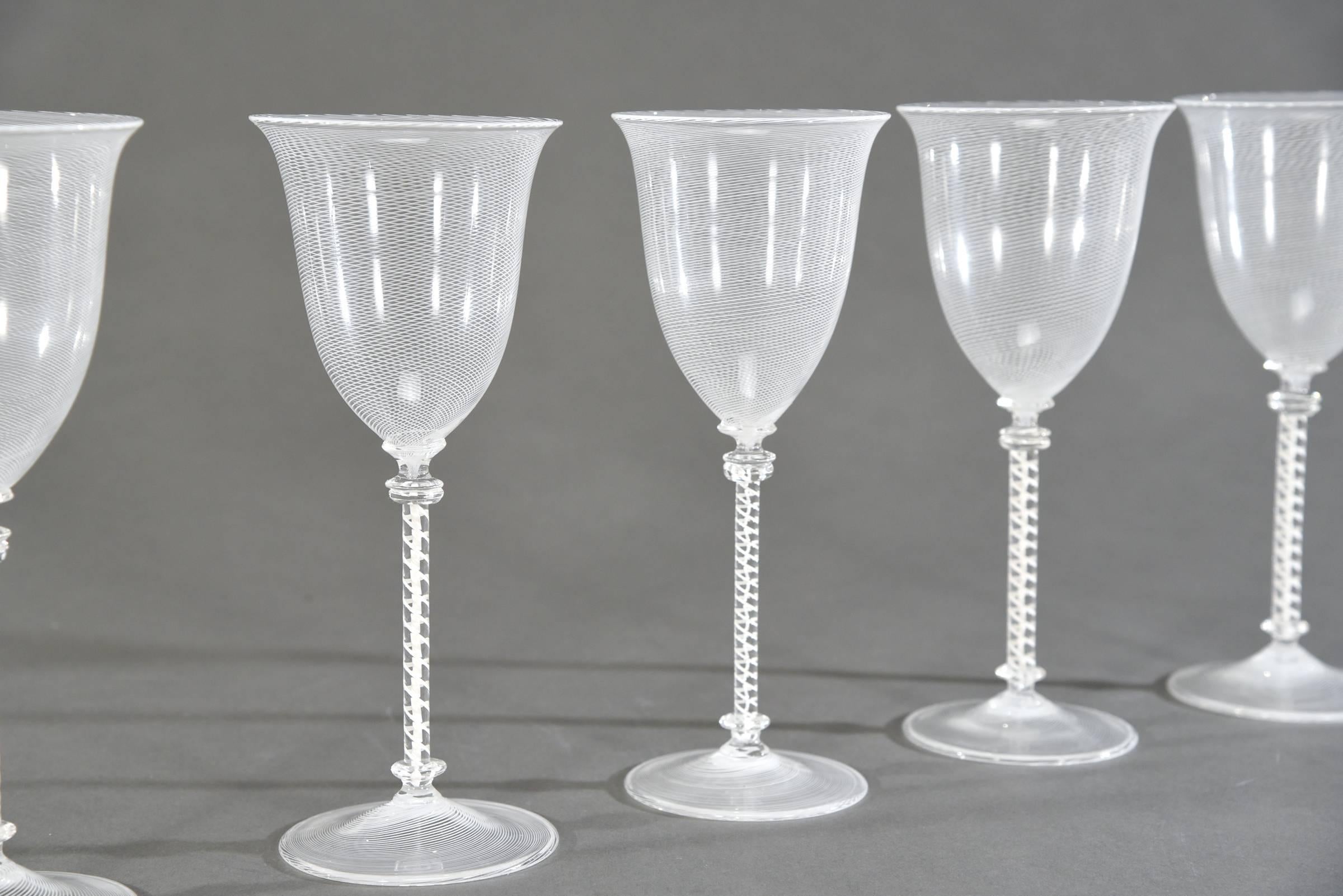 This is an amazing set of 7 hand blown goblets attributed to Cenedese, Venetian glass. They may also have been made by Scarpa...a secondary attribution. The white filligrana threading is expertly blown in concentric spirals around the bowl and the