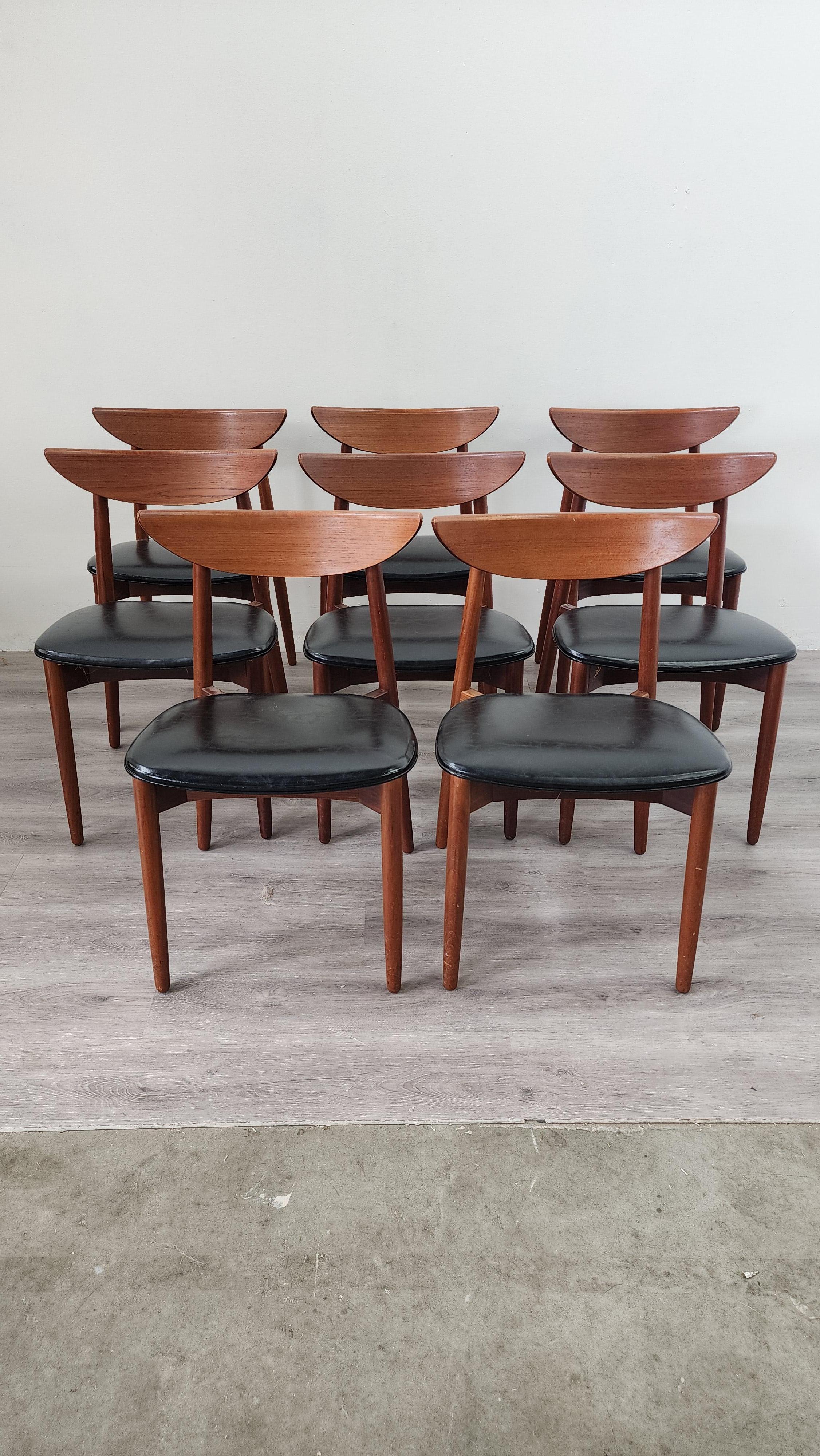 For your consideration, this set of 8 Danish teak dining chairs with ergonomic curved back and classic black uphoulstery. These chairs were designed by Harry Ostergaard for Randers Mobelfabrik, one of the most recognizable names in Danish modern