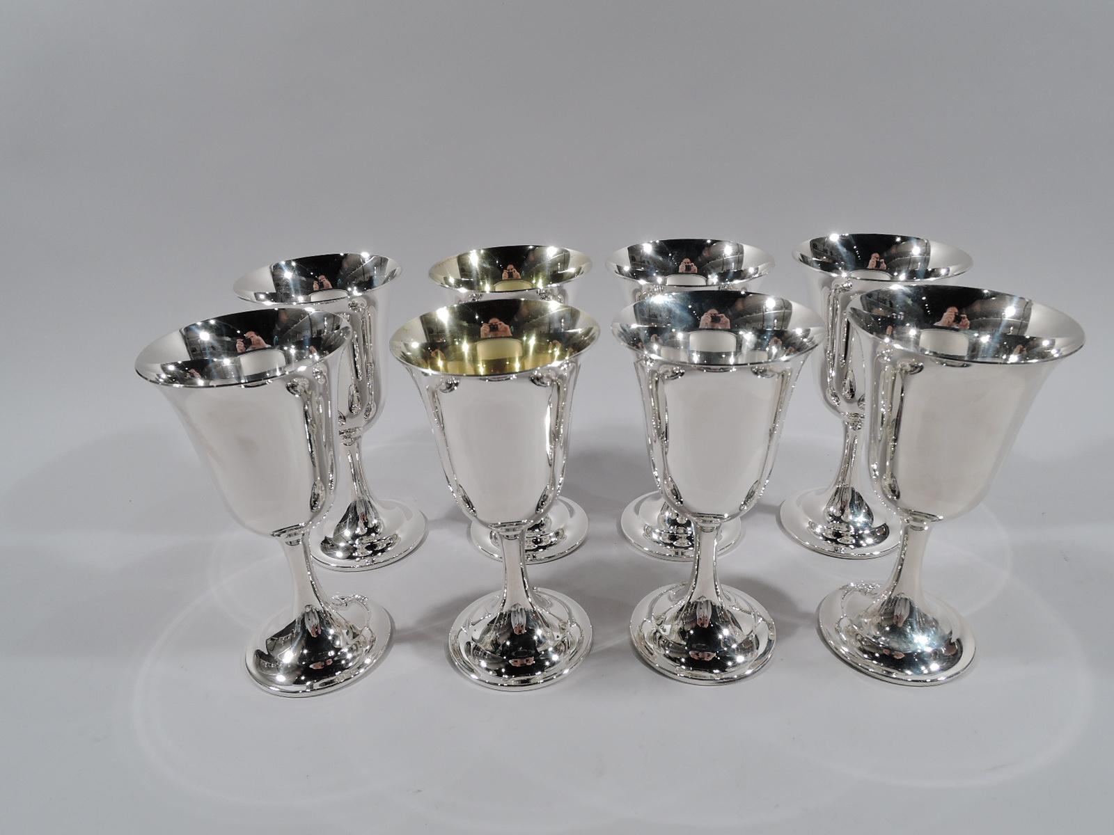Set of 8 Lord Saybrook sterling silver goblets. Made by International in Meriden, Conn. Each: Tapering bowl with fluted rim, cylindrical stem, and raised foot. Two goblets have gilt-washed interior. A graceful and traditional form that works just as