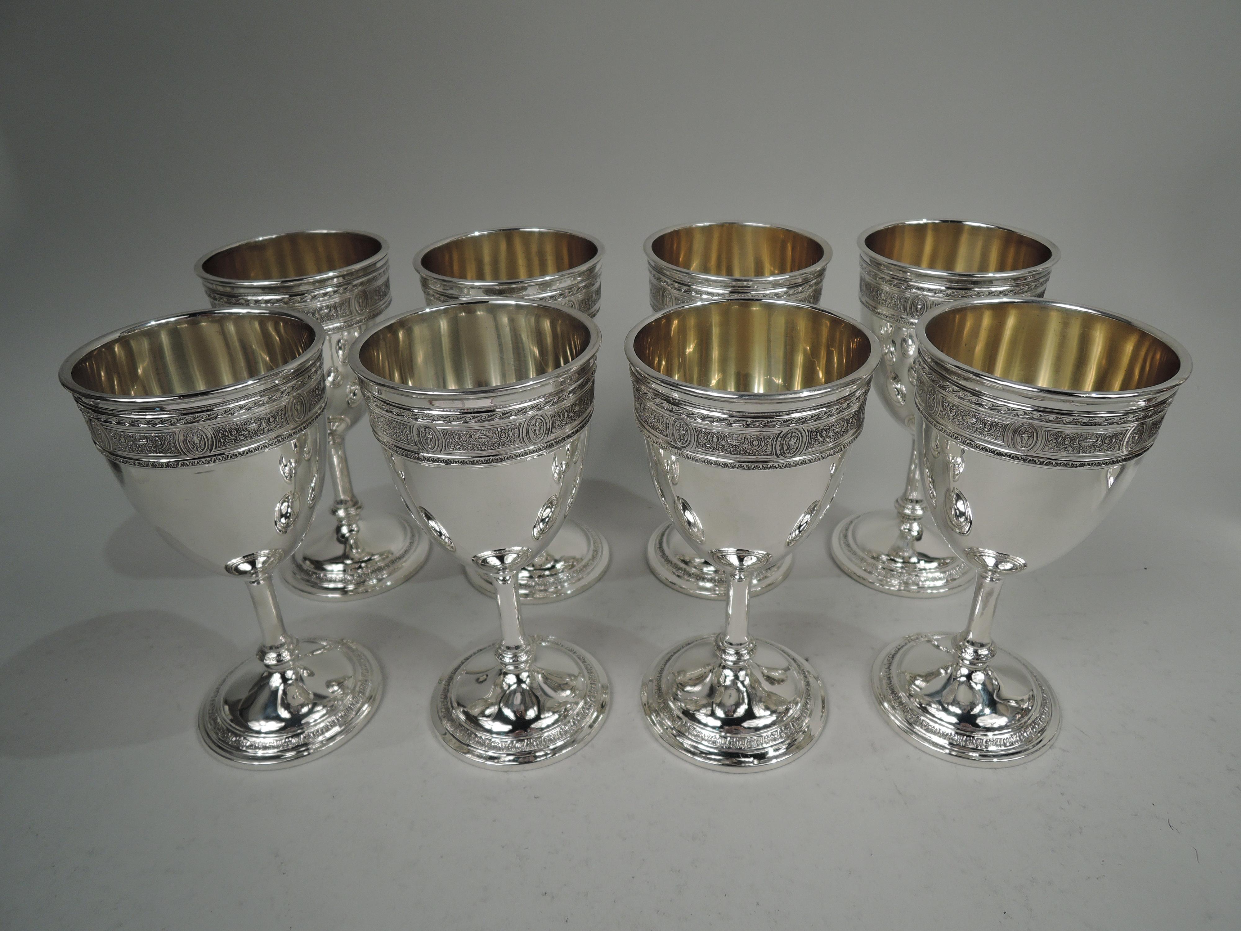 Set of 8 Wedgwood sterling silver goblets. Made by International Silver Co. in Meriden, Conn., ca 1920. Each: Ovoid bowl on cylindrical stem with base knop mounted to raised foot. At mouth rim raised band with Neoclassical ornament, including
