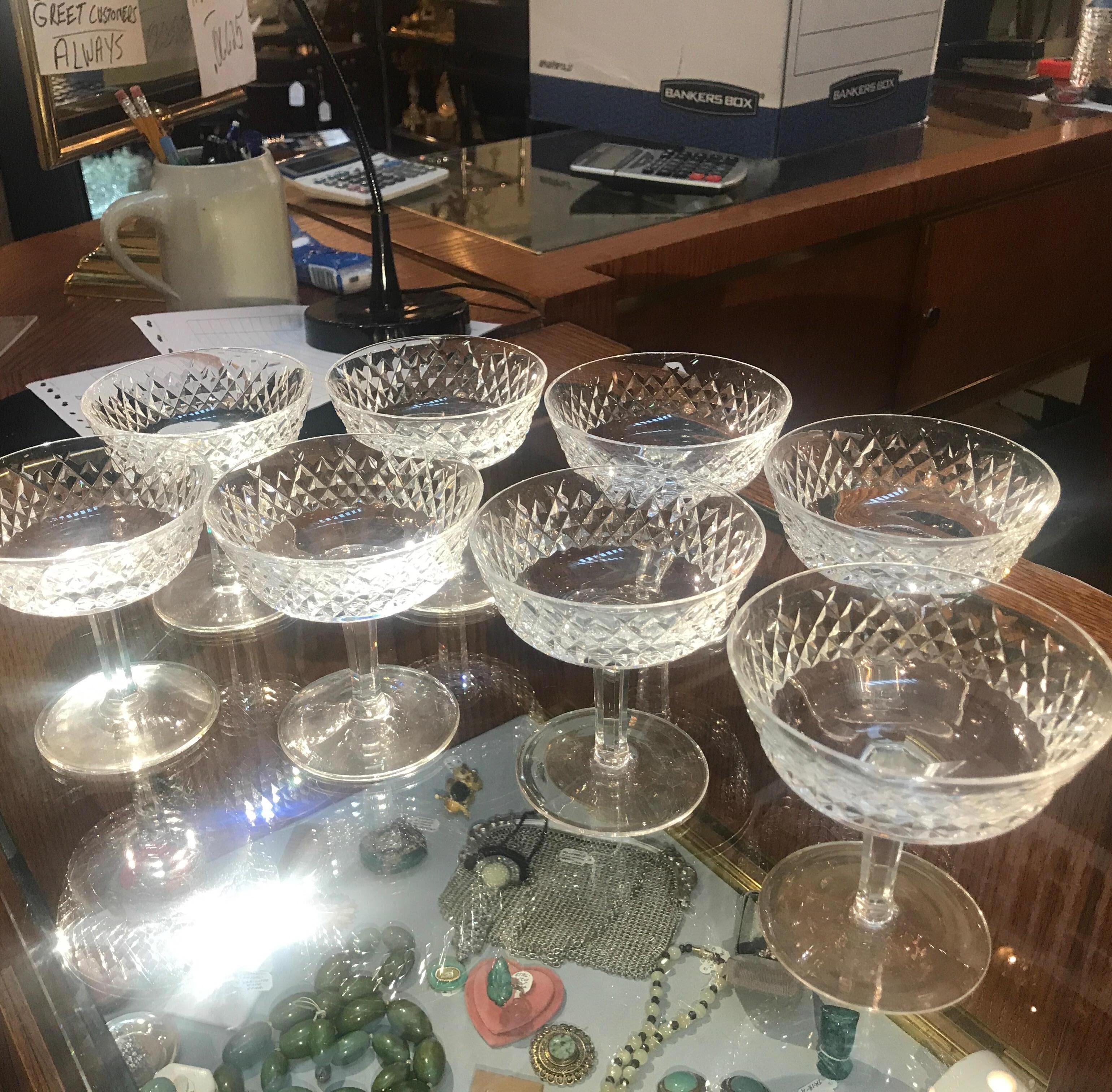 Handcut Irish crystal champagne coupes by Waterford. Handcut and polished by an expert glass cutter from Waterford in the retired Alana pattern. These are great for champagnes or as a footed dessert dish.