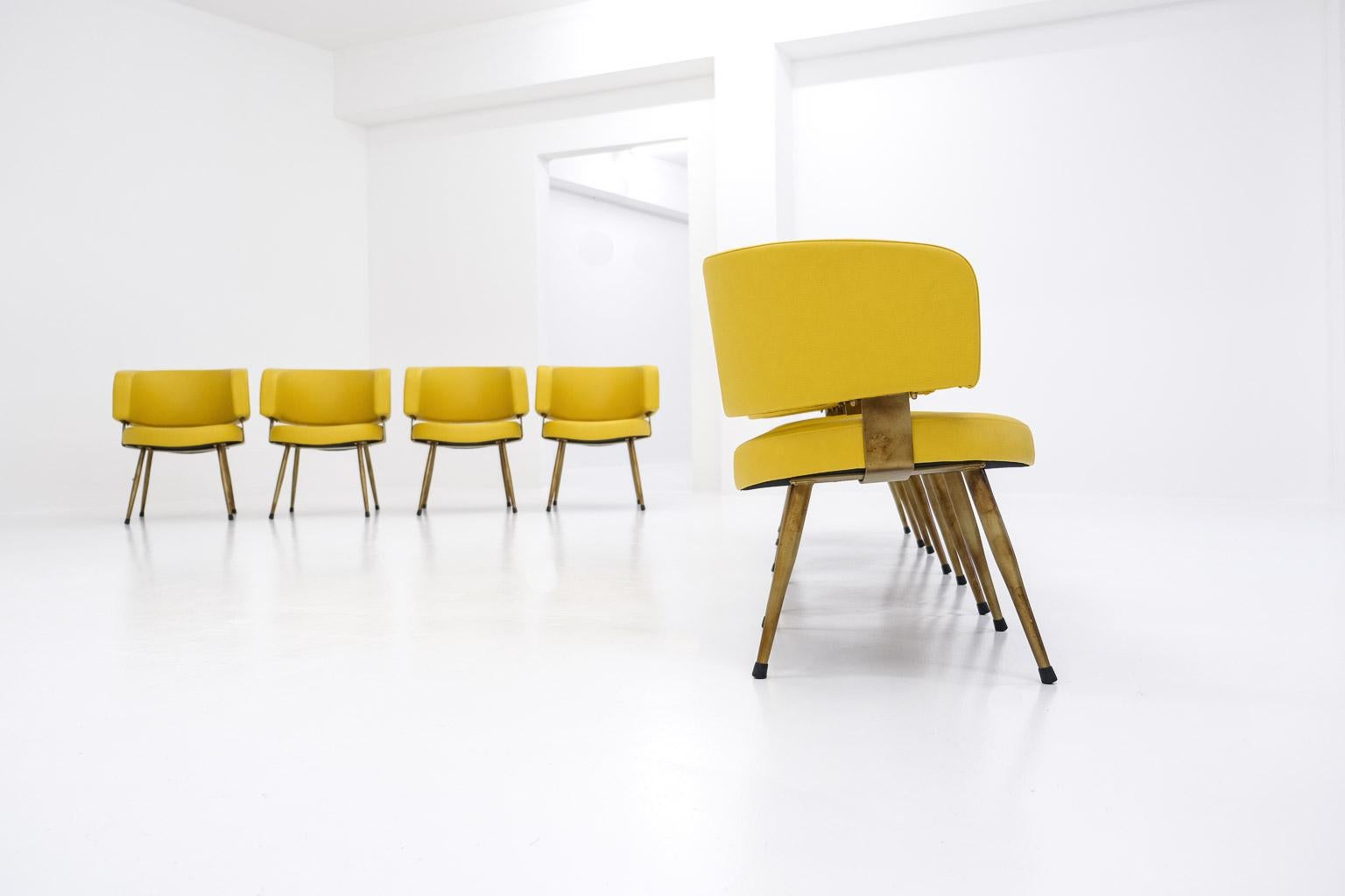 Mid-Century Modern Set of 8 Italian armchairs, newly upholstered in yellow leatherette & metal base For Sale