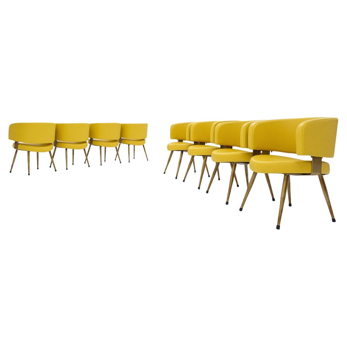 Set of 8 Italian armchairs, newly upholstered in yellow leatherette & metal base For Sale