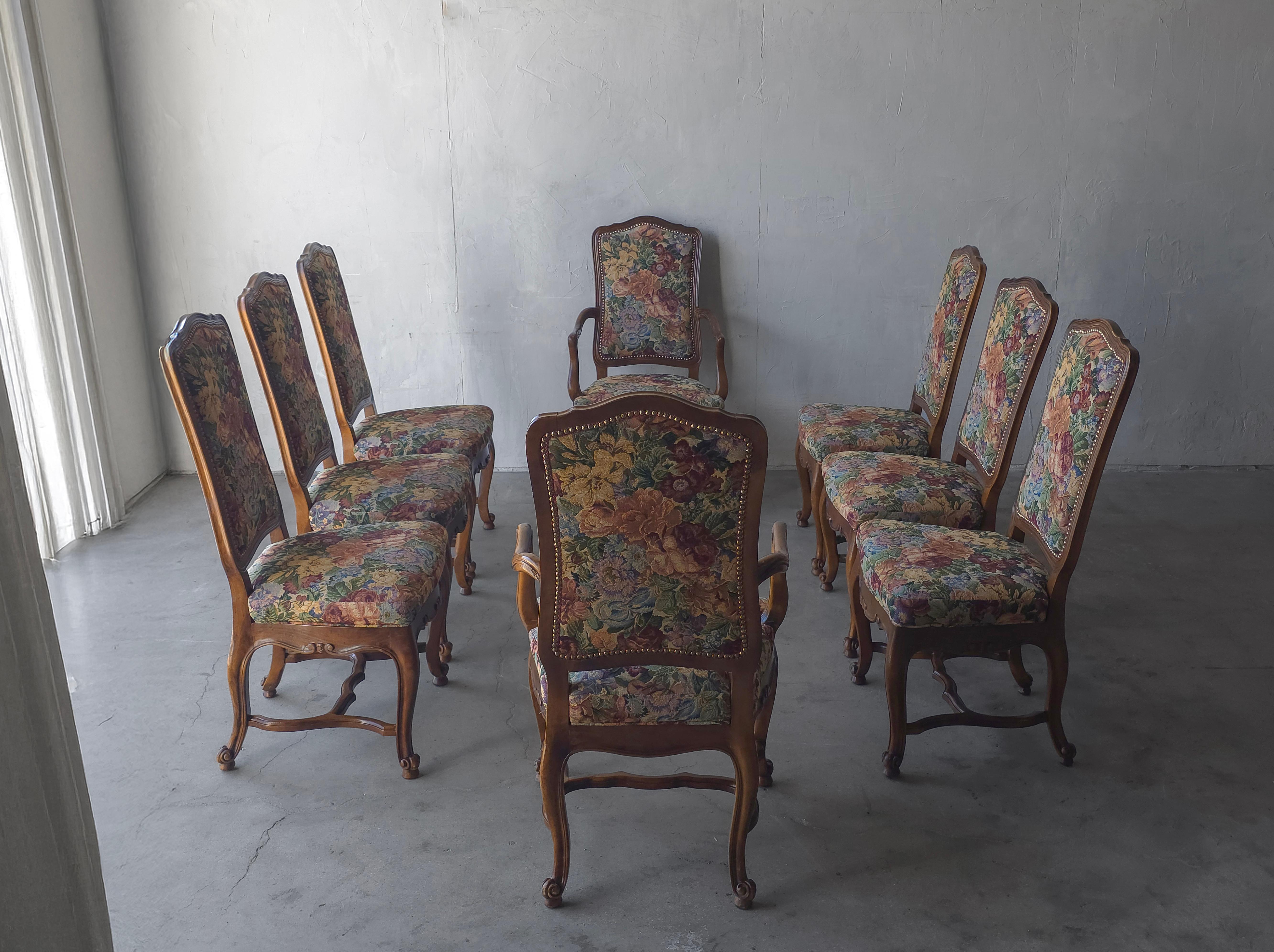 This is a nice set of Louis XV Style dining chairs with carved wood frames, cabriole legs and true floral tapestry upholstery with nail head details.  Chairs are made in Italy.

The set of 8 is in great condition with only minimal signs of age or