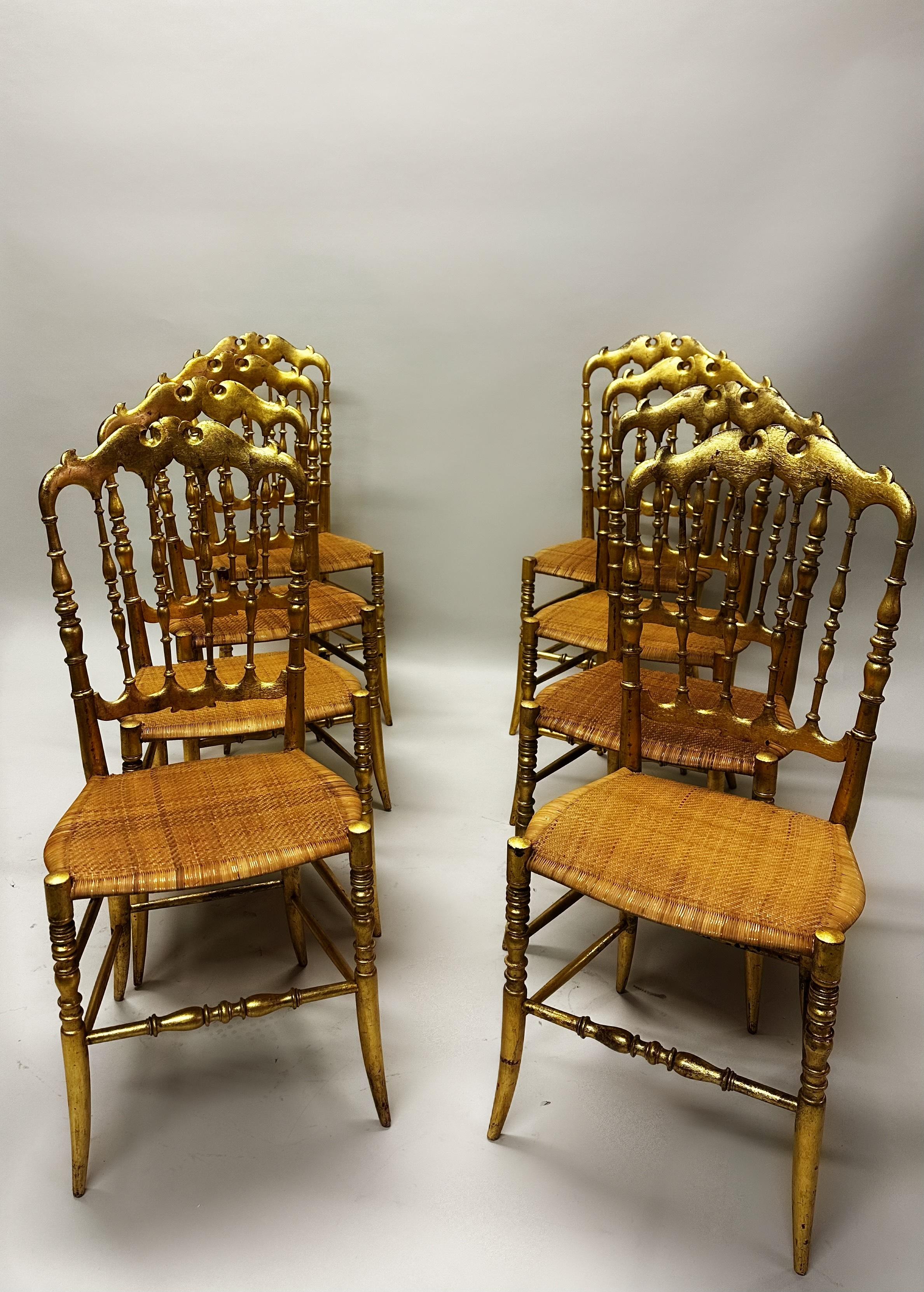 Mid-Century Modern Set of 8 Italian Modern Neoclassical Dining Chairs in Carved Gilt Wood & Rattan For Sale