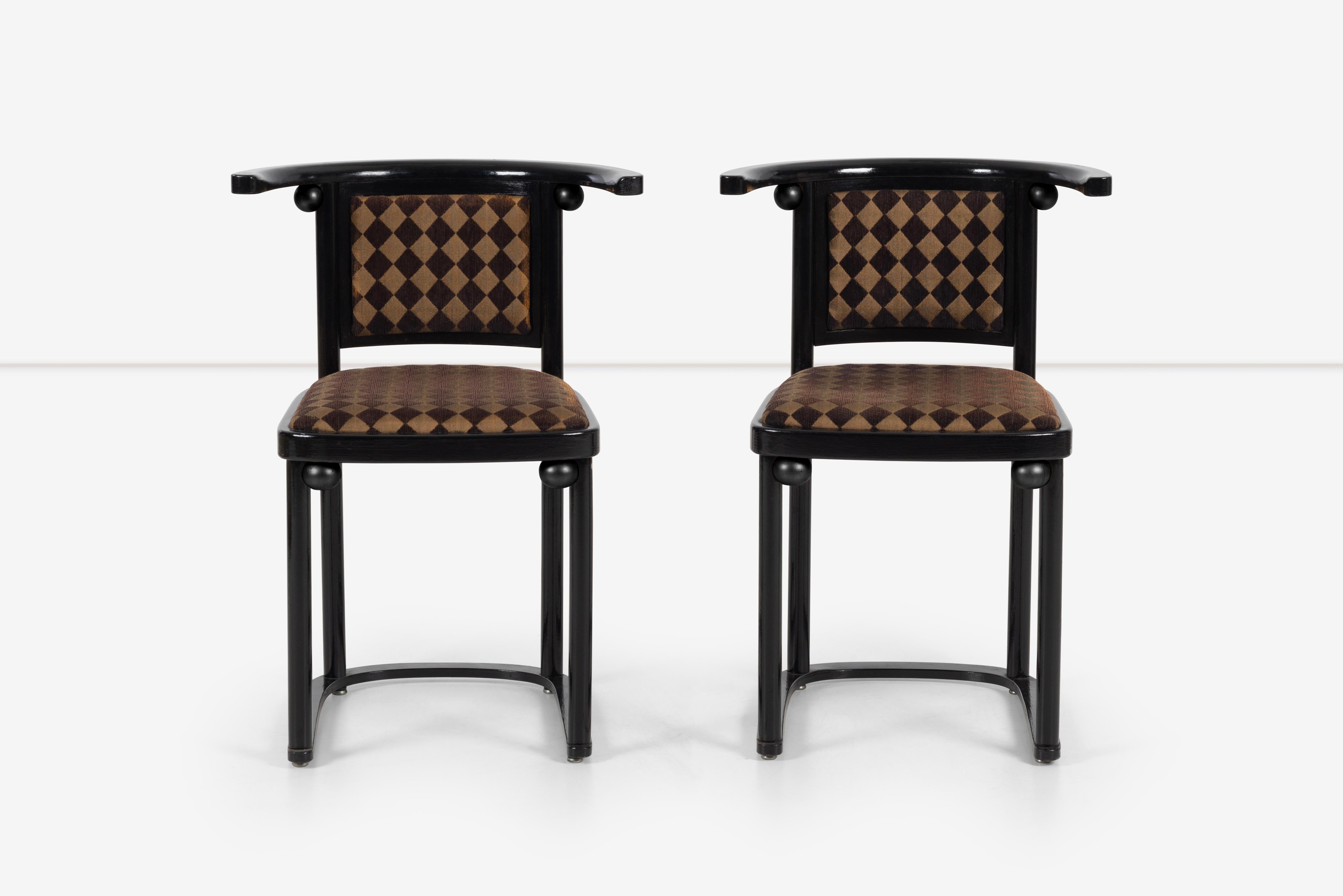 These Josef Hoffmann's black painted Fledermaus chairs are a classic and iconic piece of furniture that has been a mainstay in modern design since its creation in the early 20th century. The chair's distinctive design features a sleek and elegant