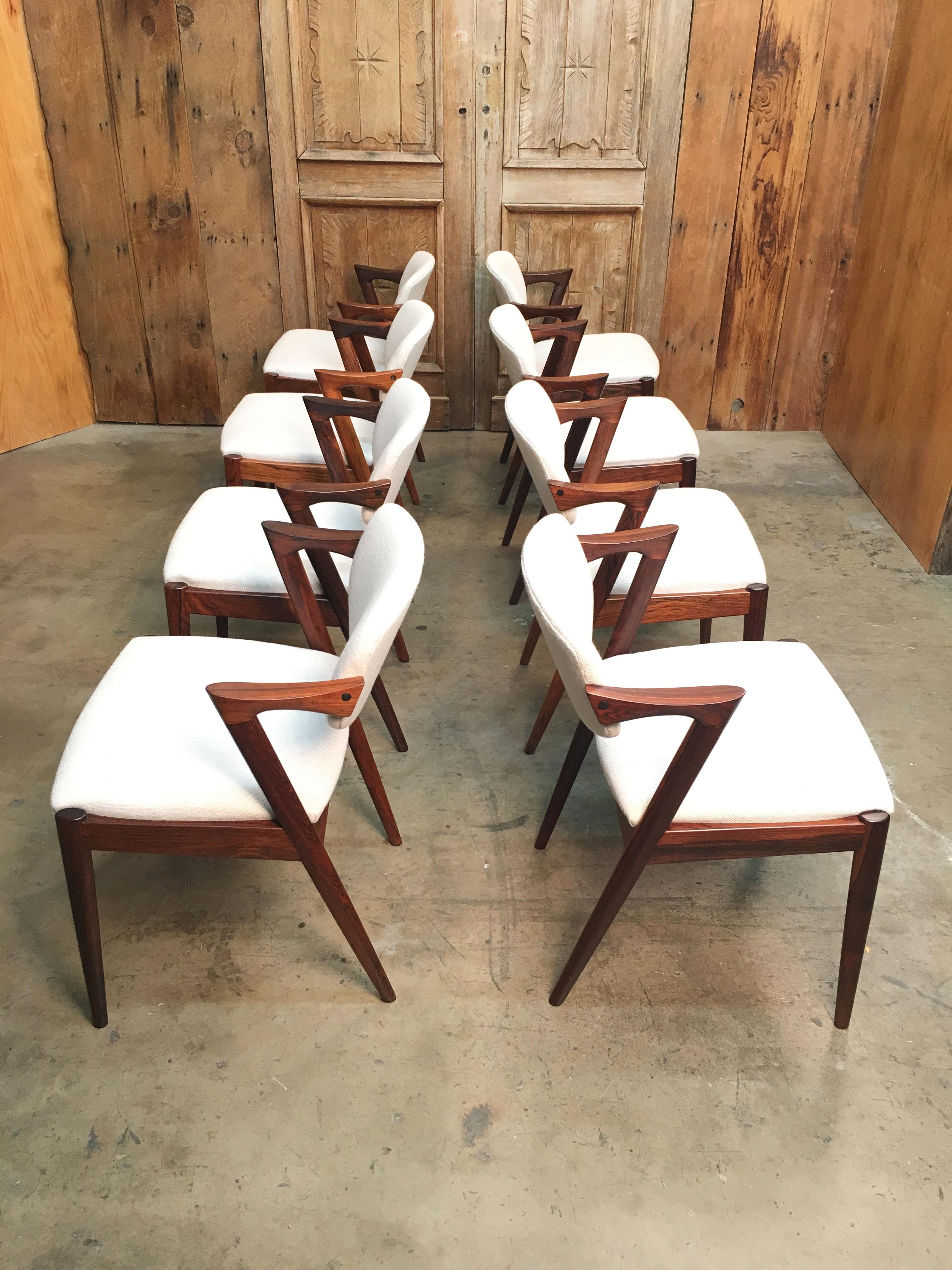 Set of 8 1960s Danish Modern rosewood dining chairs with adjustable backrest by Kai Kristiansen for Schous Møbelfabrik.
 