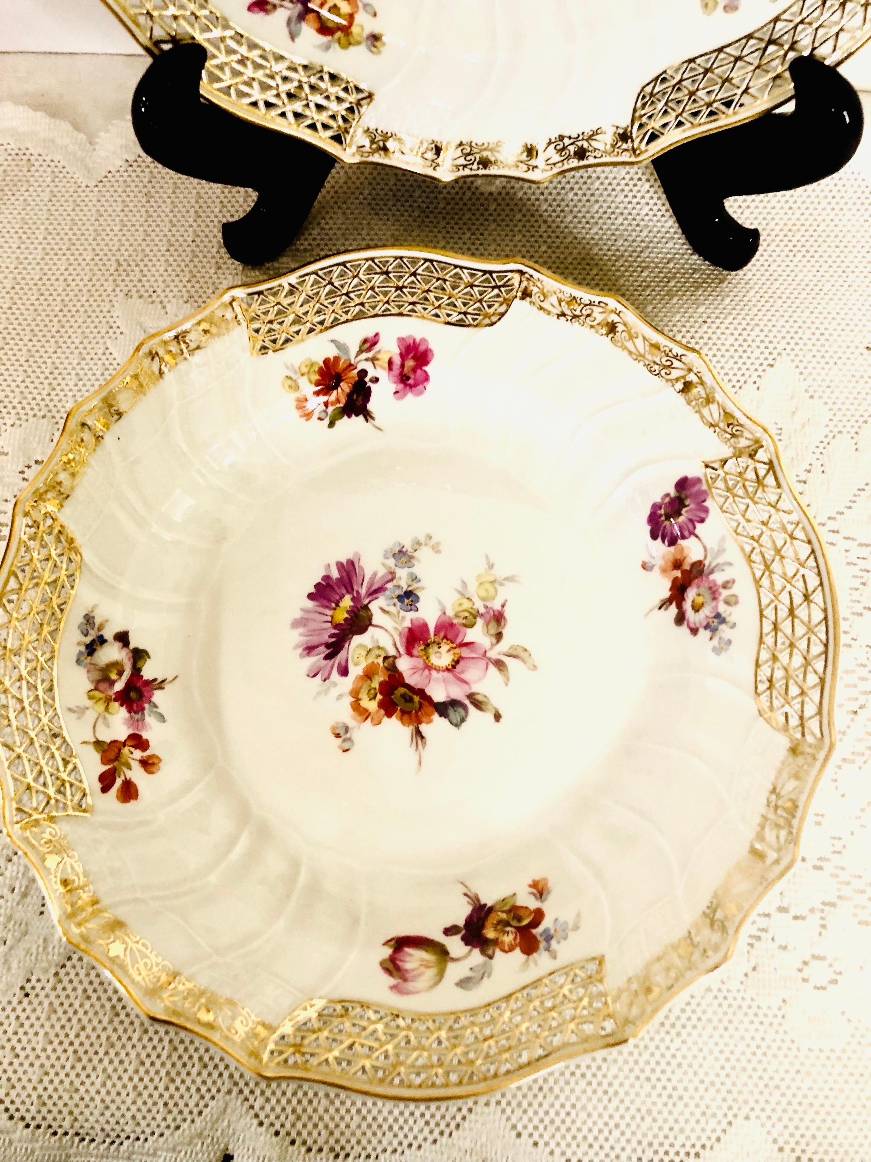 Porcelain Set of 8 KPM Dinner Plates with Reticulated Border And Different Flower Bouquets For Sale