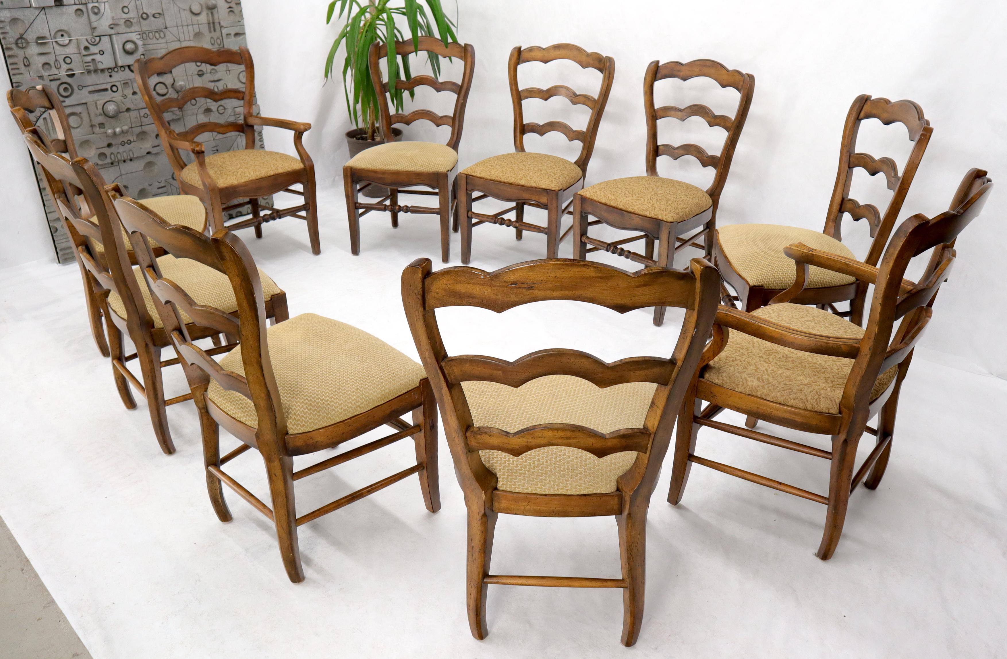 Set of eight ladder back colonial Spanish dining chairs by Henredon.