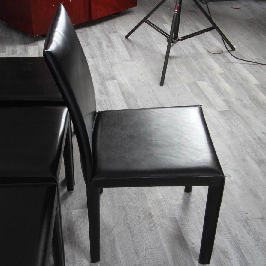 High quality set of 8 steel frame bonded leather upholstered modern design dining chairs by Maria Yee.