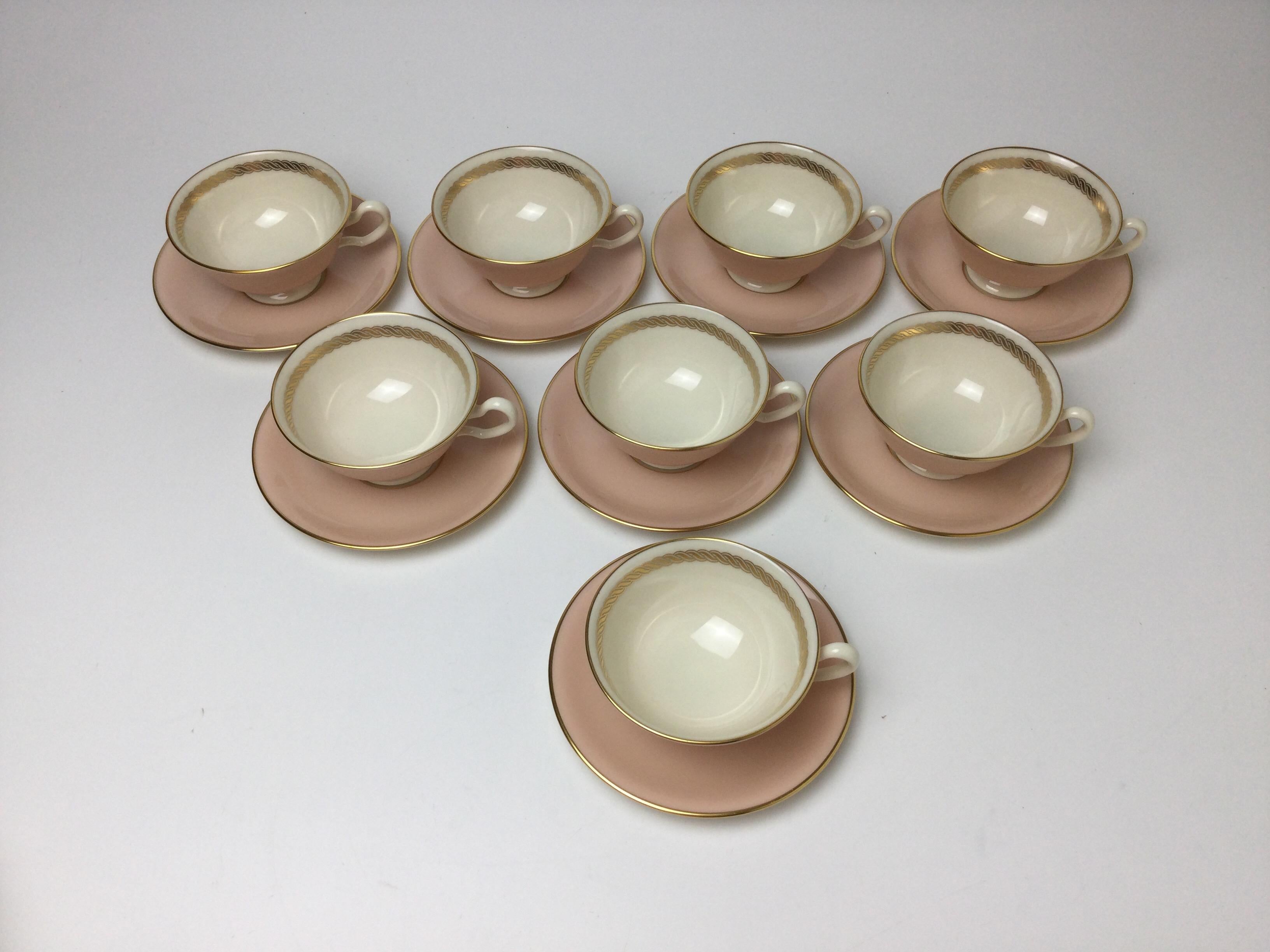 Set of 8 Lenox caribbee cups & saucers with pink and gilt borders. Saucers are 5 3/4