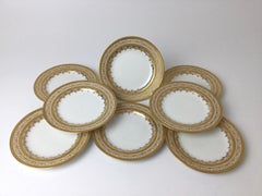 Set von 8 Limoges-Brotter- und Buttertellern mit Goldverzierung