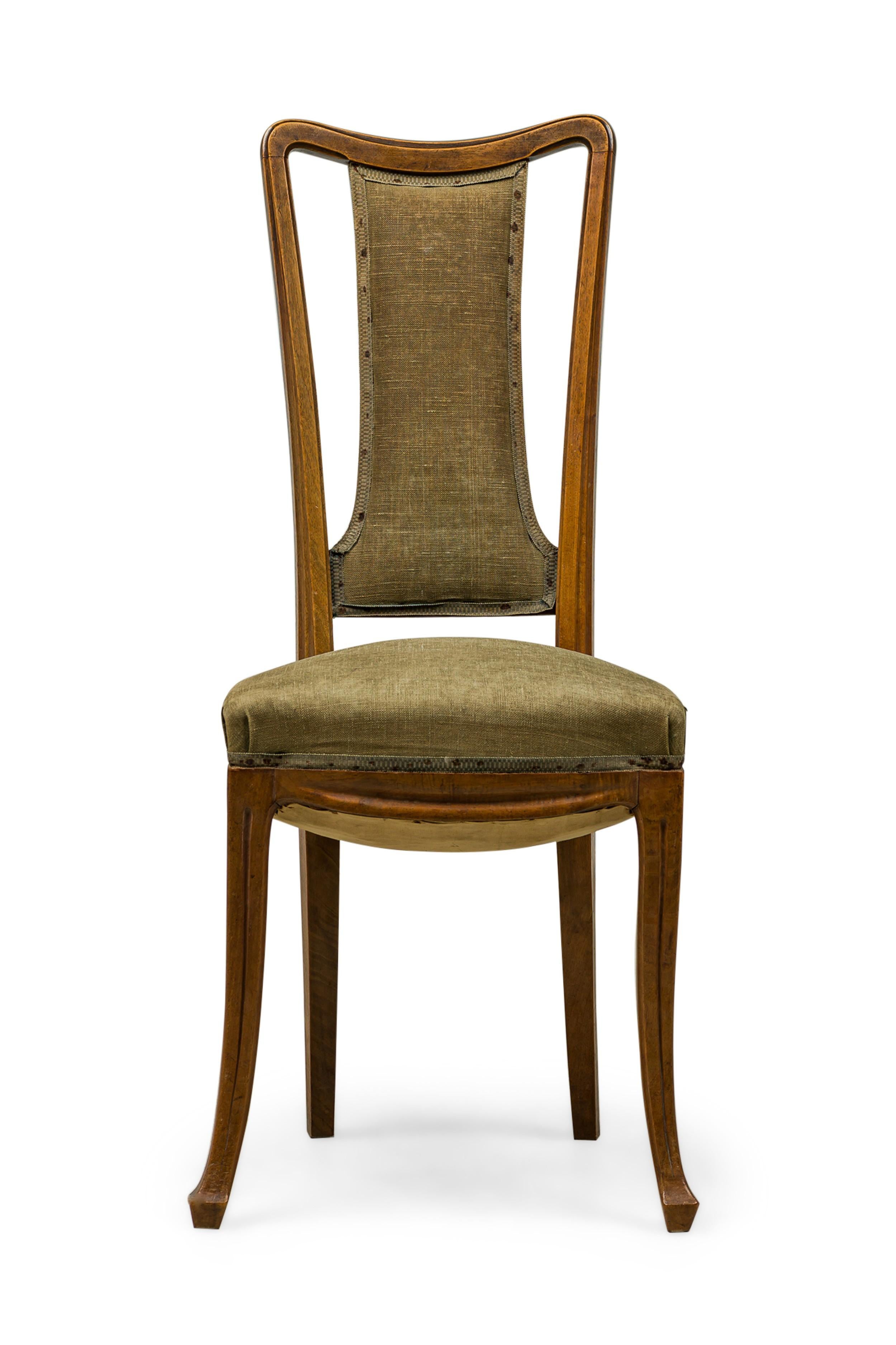 SET of 8 French Art Nouveau side chairs with carved walnut frames, openwork backs featuring a central upholstered section and seat upholstered in a sage green muslin. (LOUIS MAJORELLE)(PRICED AS SET)
 

 Wear to frame finish, some stains and fading