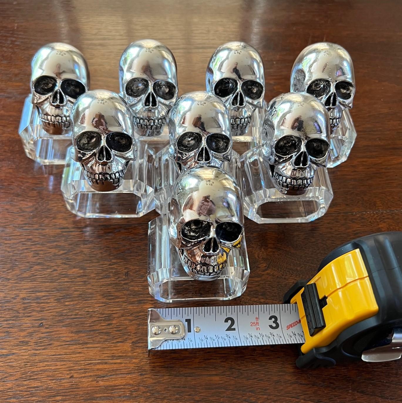 Late 20th c a set of 8 molded skull heads on lucite modern bases, outstanding details on the heads. Great for Halloween or year round entertaining. Nice substantial weight.

Dimensions:
Each ring approx 2.25
