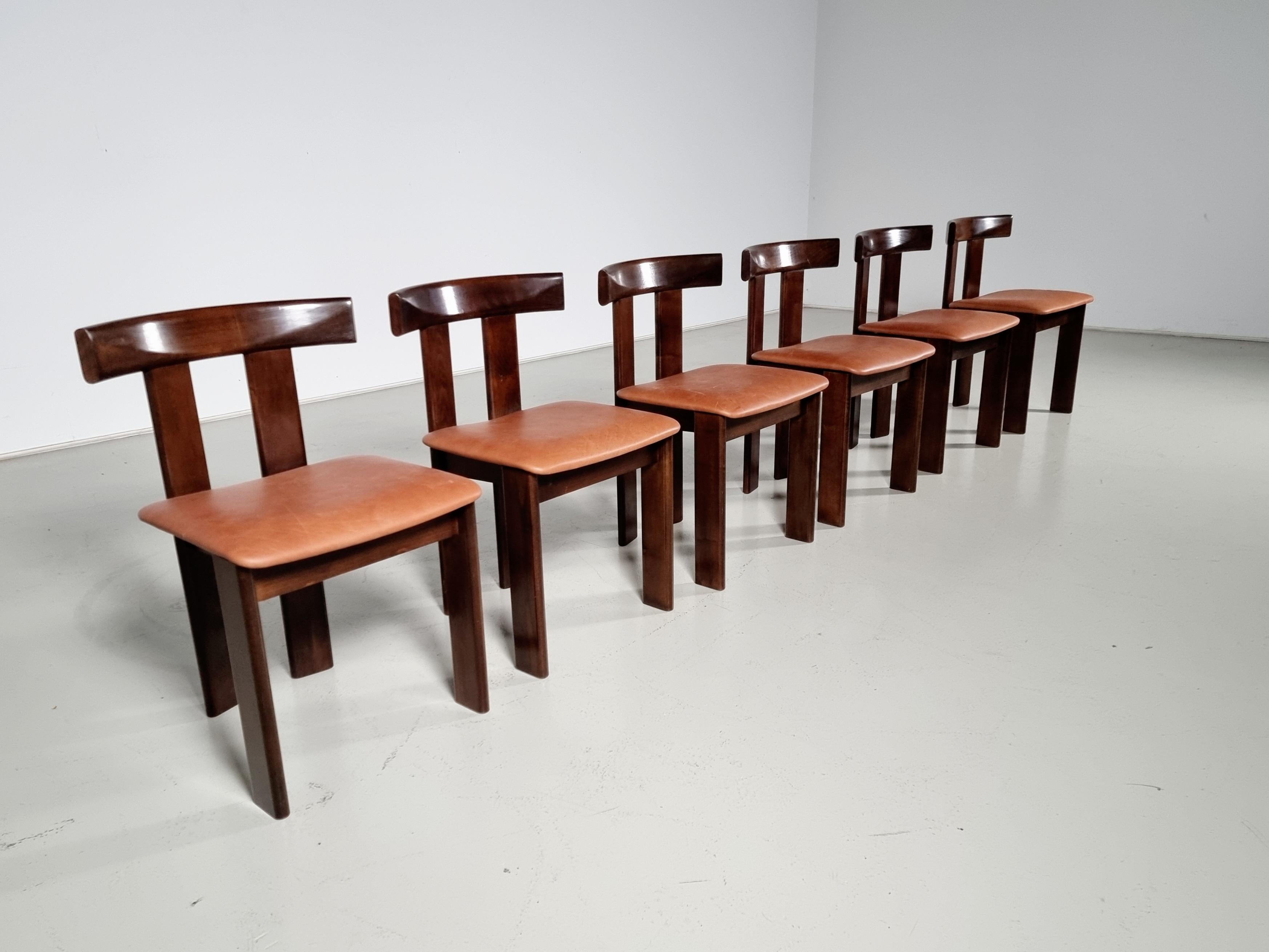 Set of 6 dining chairs by Luigi Vaghi for Former, 1960s.  

Beautiful set of 6 'T-chair' dining chairs in dark stained ash and cognac leather upholstery. Simplistic yet very strong in lines and proportions. Wonderful frame executed in dark stained