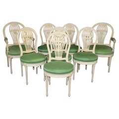 Ensemble de 8 magnifiques chaises de salle à manger peintes à dossier en forme de ballon attribuées à la Maison Jansen