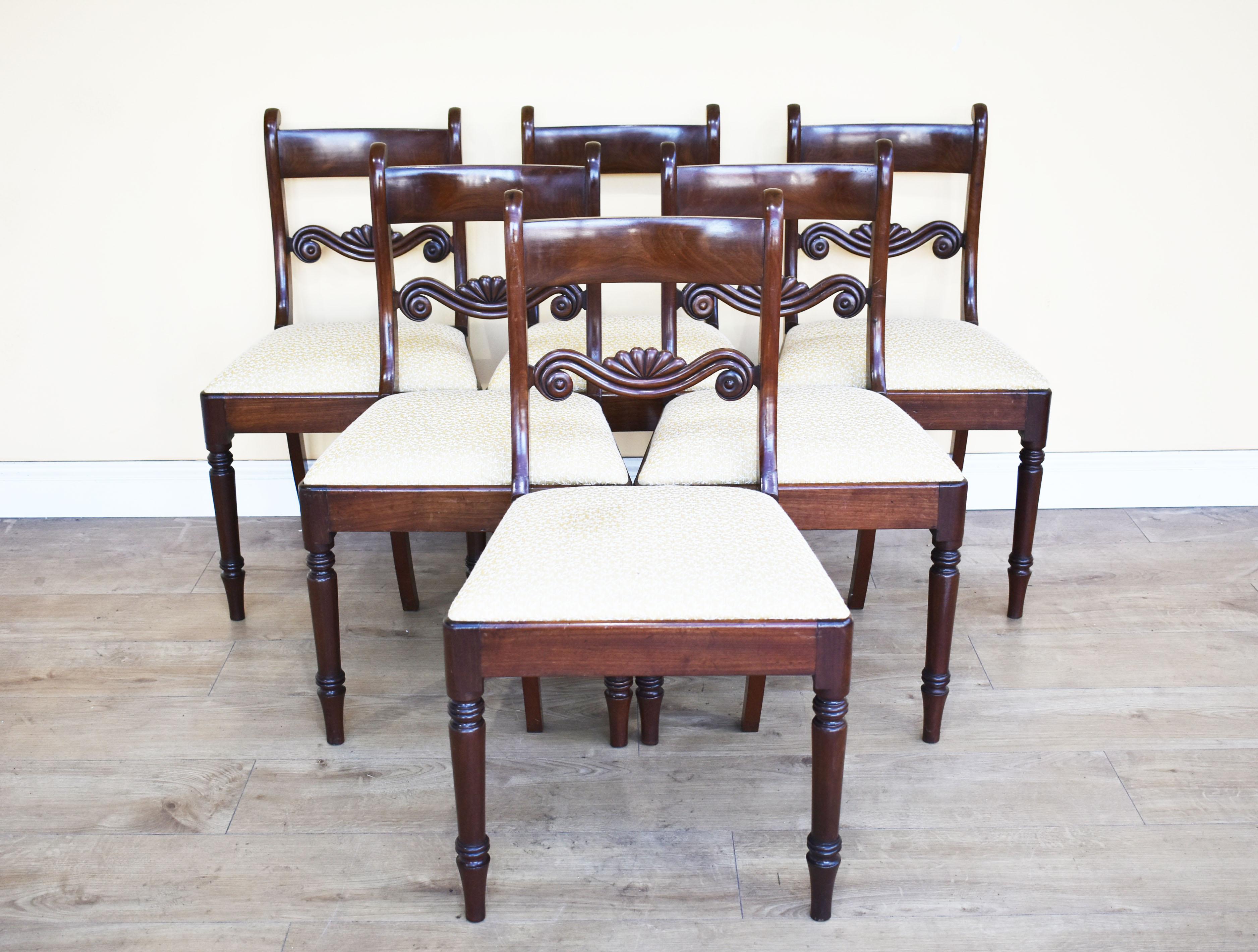 For sale is a set of 8 mahogany dining chairs, each with bar backs above a carved central rail, 19th century. Each chair has a drop in seat and stands on finely turned legs. All of the chairs are in good condition being structurally sound, there are