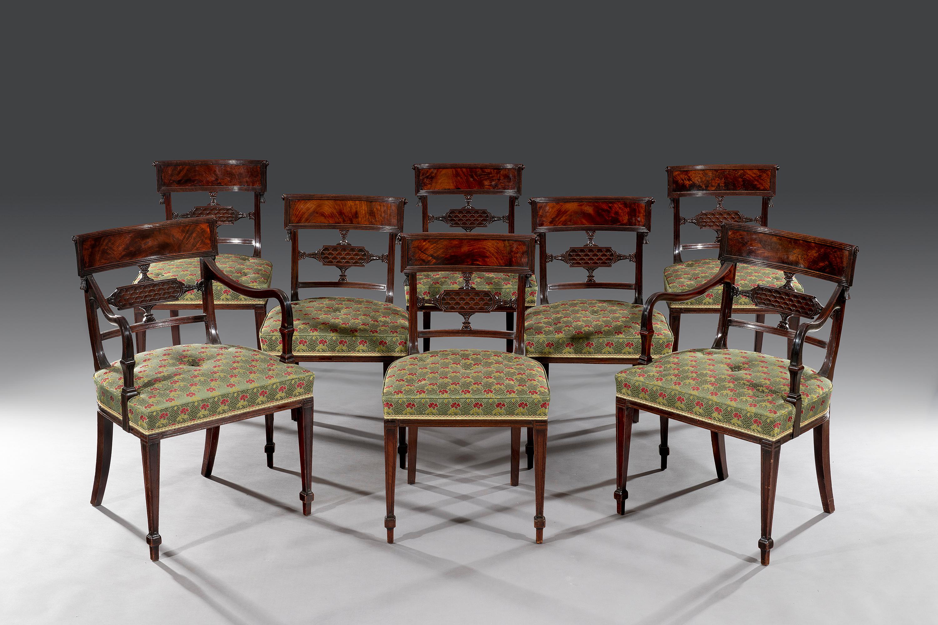 Fine Set of Eight George III Sheraton Period 18th Century Carved Mahogany Dining Chairs

The dining chairs are of the highest quality and design with each of the chairs made with highly figured mahogany veneered headrails. above a crisply carved