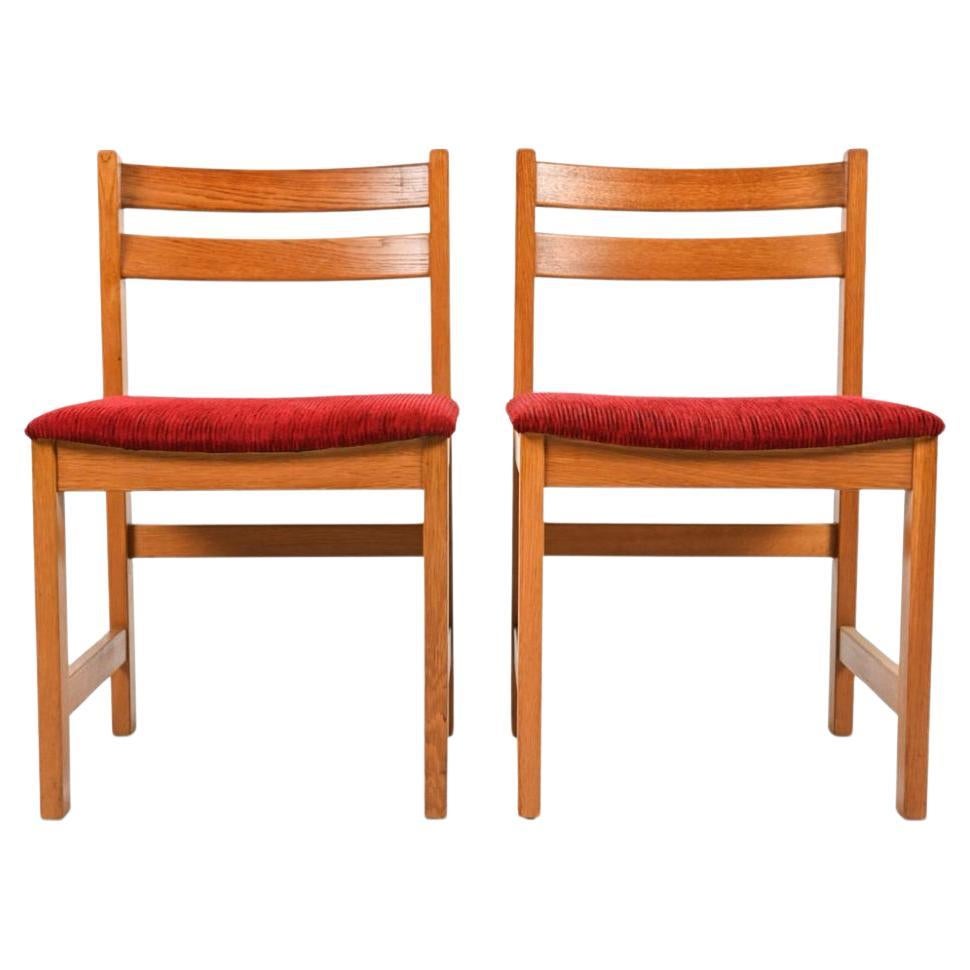 Set of 8 Mid century danish modern oak dining chairs. Solid oak frames with red Corded cut velvet upholstery. Scandinavian modern design with simple lines. Great set of (8) dining chairs. Ready for use or have them reupholstered to a fabric of your