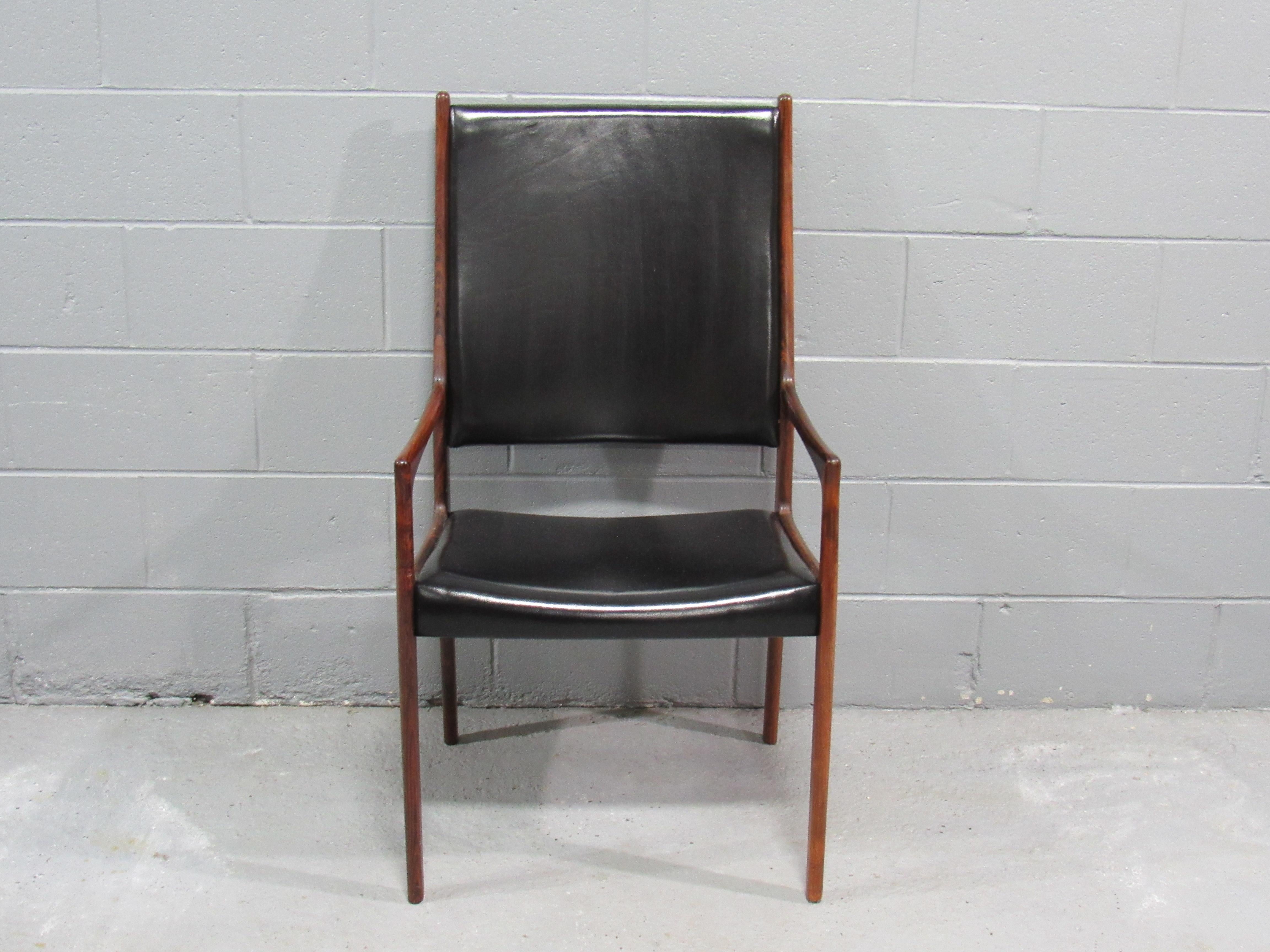 Set of 8 Mid-Century Danish Modern Rosewood Dining Chairs (6 dining chairs and 2 armchairs) by Johannes Andersen for Mogens Kold Mobelfabrik.  Very nice and large set of high back dining chairs designed by Johannes Andersen and manufactured by