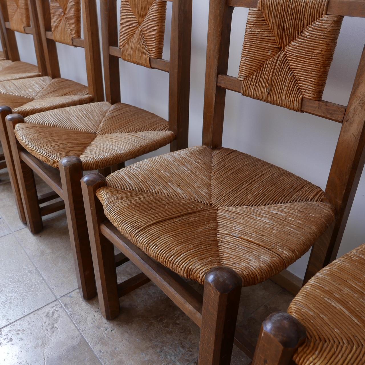 A set of eight midcentury dining chairs,

circa 1950s, rush seating and backs, solid wood construction.

Dimensions: 46 W x 45 D x 44 seat height x 85

Some scuffs as per age.

Delivery: POA.

 