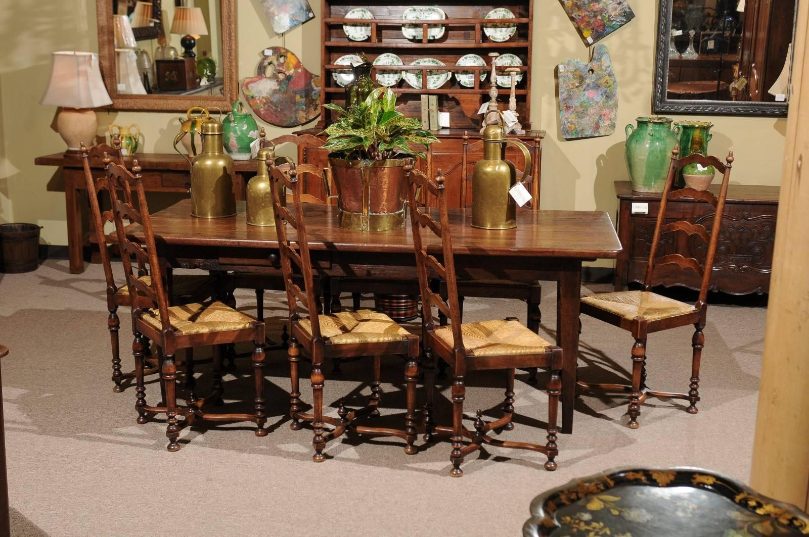 Set of eight midcentury French walnut ladderback chairs, circa 1950
What a pretty set of chairs. The walnut is the perfect color and patina and the detailing gives the chairs a nice profile. The chairs have rush seats and are comfortable. Sets of