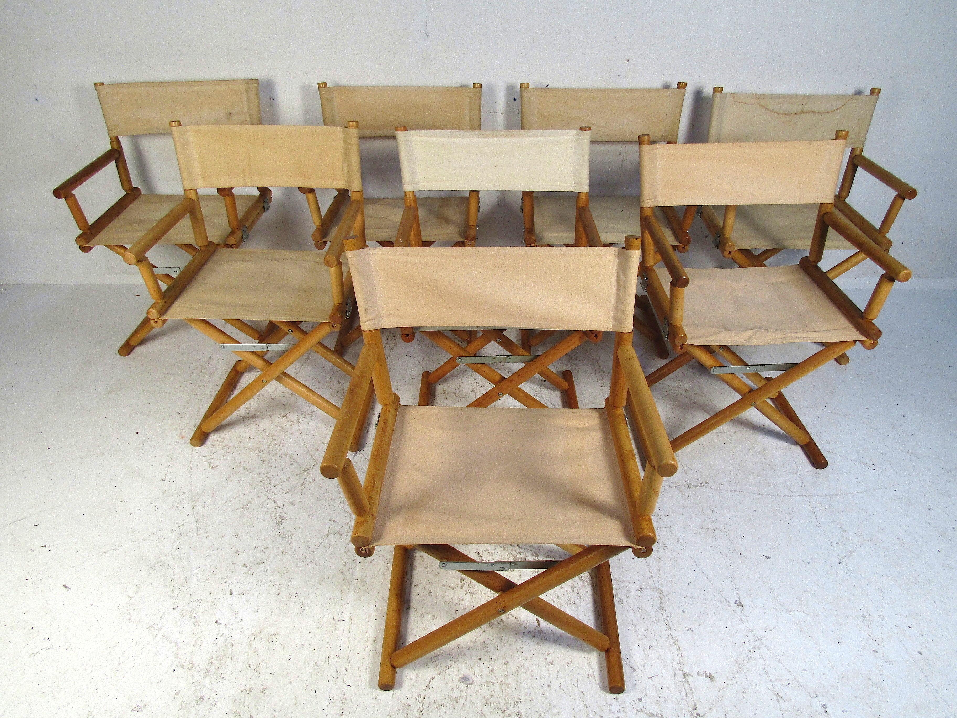 Vintage hardwood; deep grained folding chairs with a canvas seat and back. Inspired by a mid-century movie studio; this set will complete any home bar or home office setup. Additionally, the backs can be removed from these chairs making a stylish