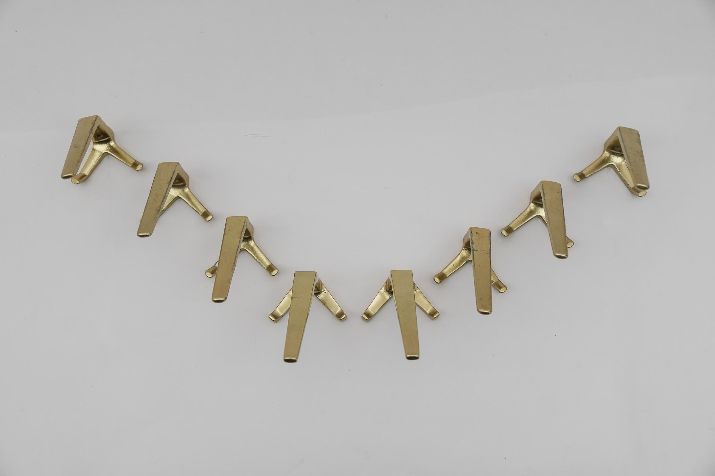 Austrian Set of 8 Mid-Century Modern Brass Wall Hooks, Austria, 1960s For Sale