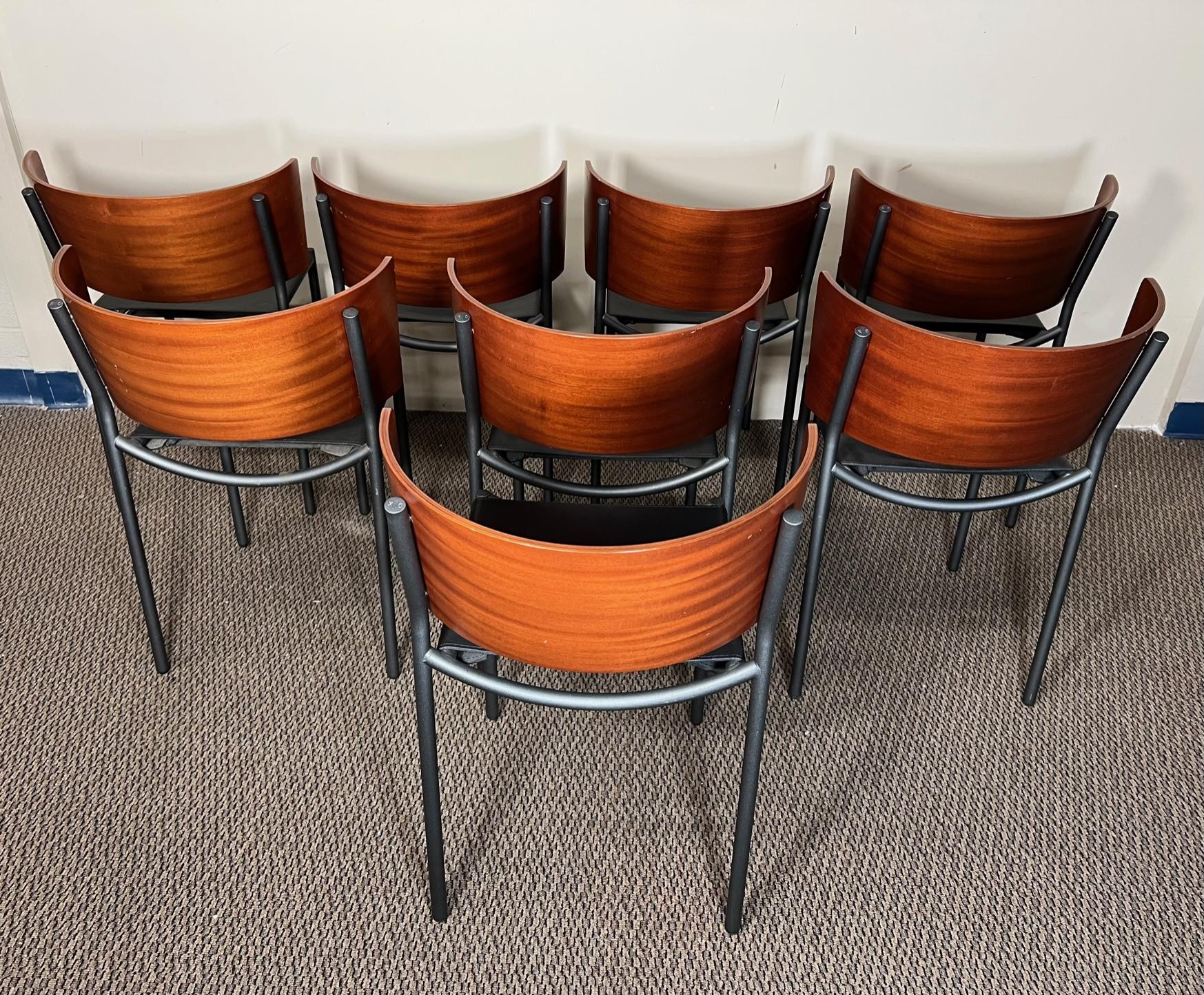 Beautiful set of 8 chairs with bent wood back and steel frames. Lila Hunter chairs by Philippe Starck for XO.

Very nice condition overall. All the chairs are very sturdy. Black leather seats. Some marks from normal use. One chair with a small