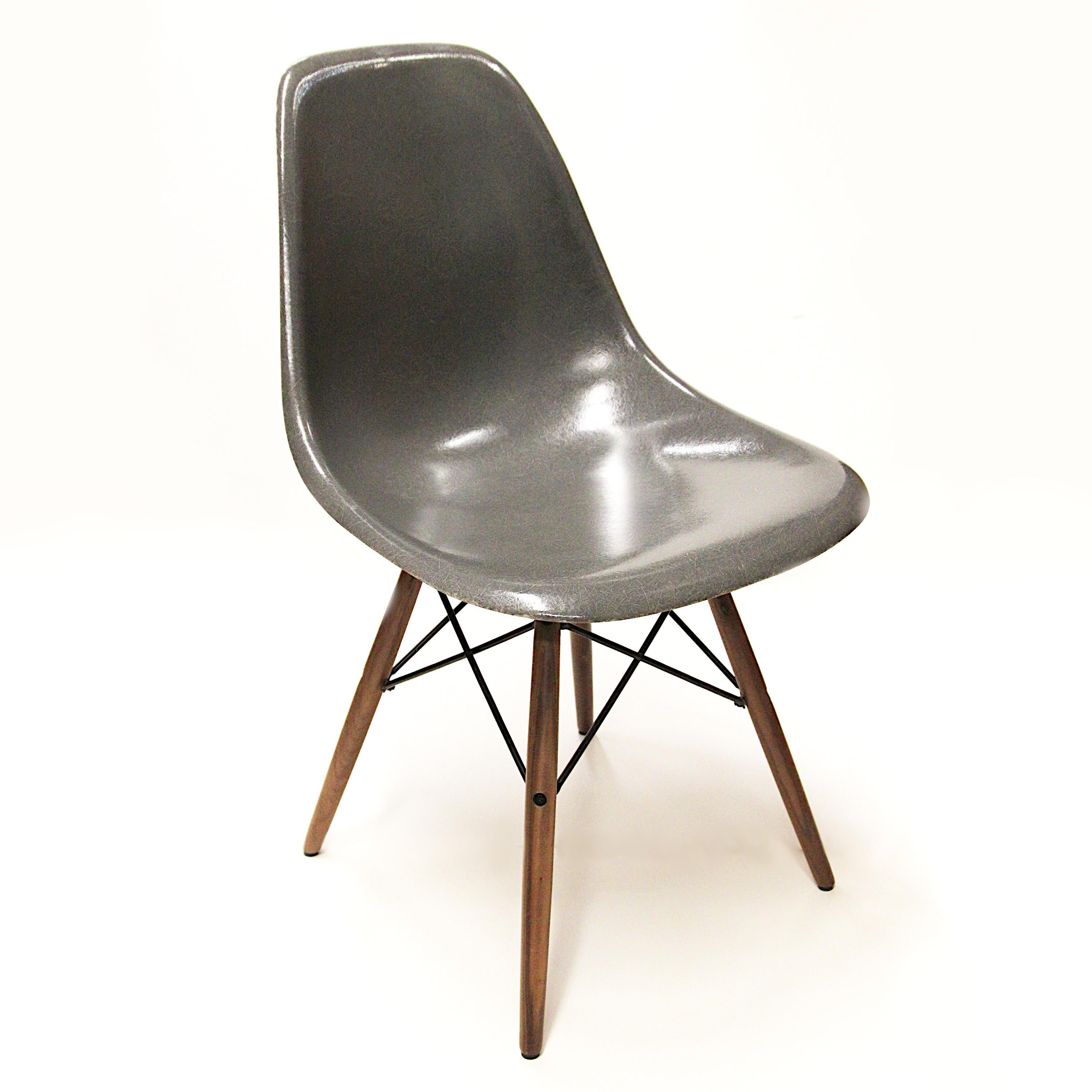 Fantastic set of original vintage fiberglass shell chairs by Charles & Ray Eames for Herman Miller. Chairs feature a rare 