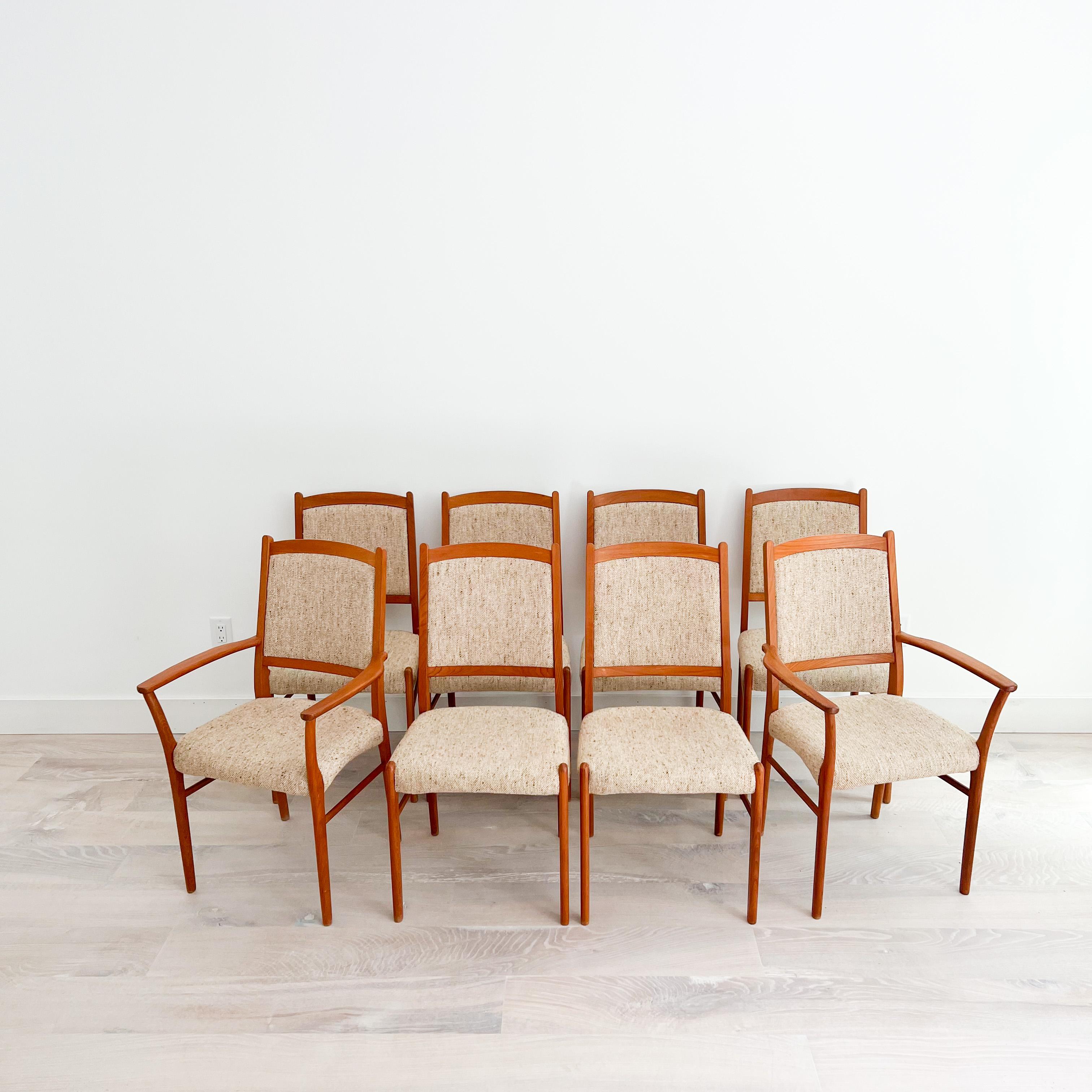 Set of 8 Mid-Century Modern Danish teak dining chairs with original upholstery. The upholstery is in good condition overall but does have some light piling from age appropriate wear. The teak has some light scuffing/scratching to the teak frames.
