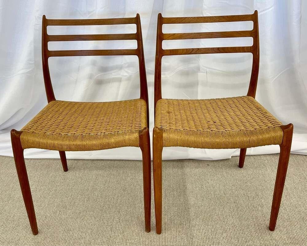 Set of eight dining chairs by Niels Otto Moller For J.L. Moller, Denmark, 1950s. Model 78. A sleek and stylish set of Teak dining chairs with Rattan seats and ladder backs. Six having Danish Moller Labels and four having original Danish stamps. Two