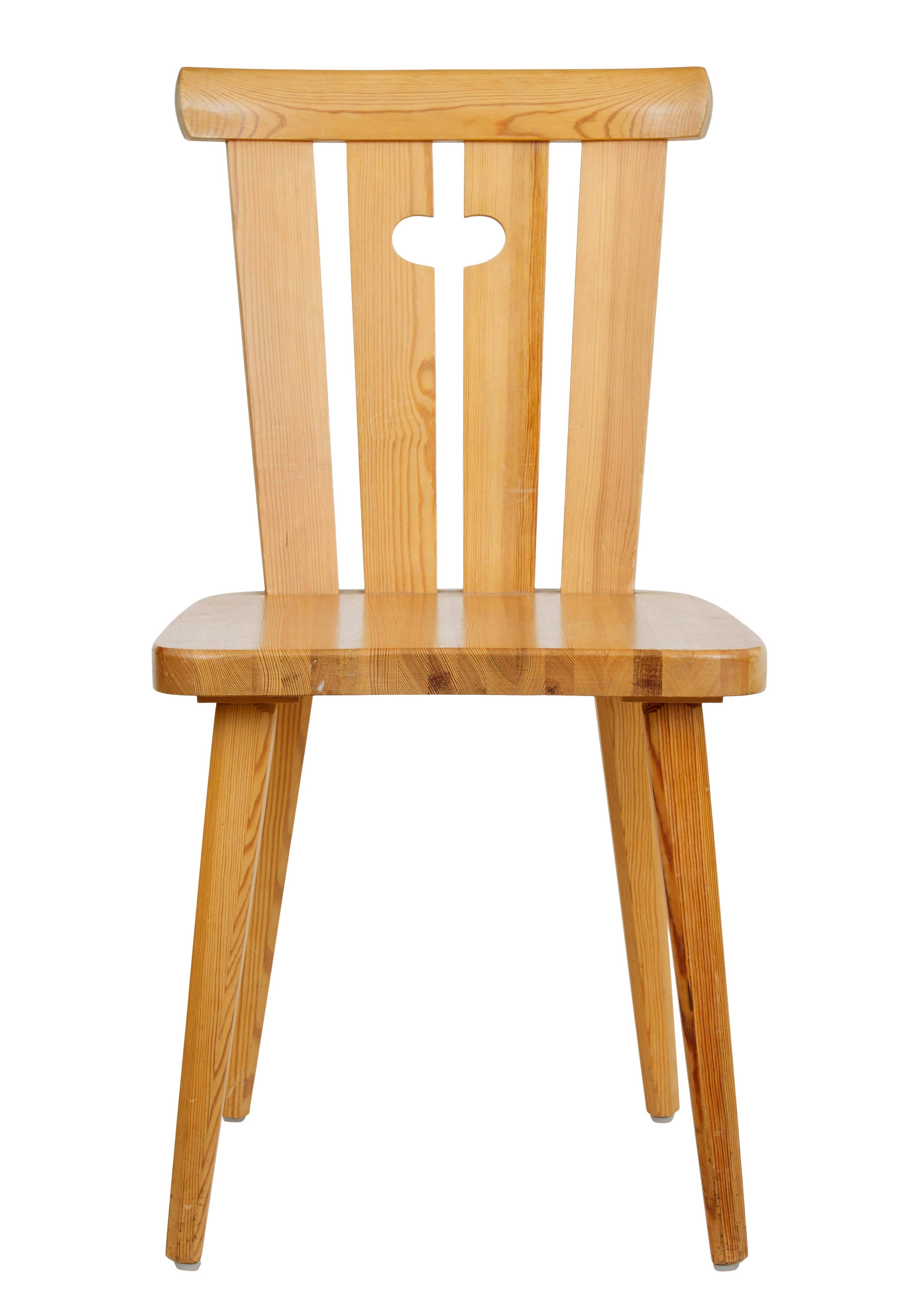 Practical set of Swedish 1970's dining chairs.

Shaped backs with 4 back slats with a carrying handle cut out. Plain seat, standing on tapered legs.

Simple elegant design and comfortable.

Good rich pine color. Expected surface marks from use,