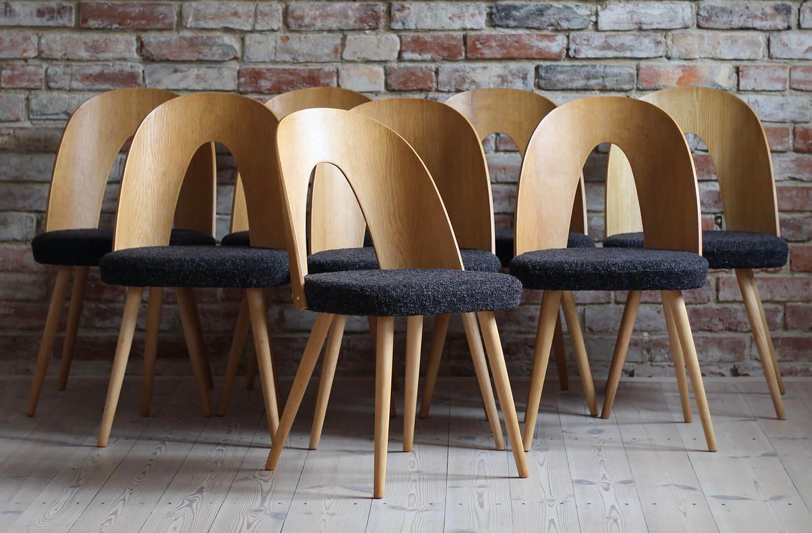 This set of 8 vintage dining chairs was designed by Czech designer Antonin Šuman in the 1960s. The chairs have been completely restored finished with high-quality oil that gave them beautiful and natural finish. This set is reupholstered with