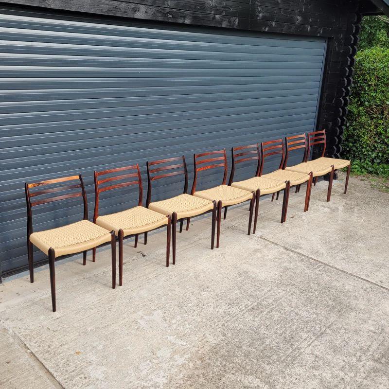 Set of eight rosewood dining chairs designed by Niels Otto. Møller for J.L. Moller Mobelfabrik, Denmark in 1962. Seats re woven with natural Danish paper cord.  All restoration and weaving work is undertaken at our workshop.

These present