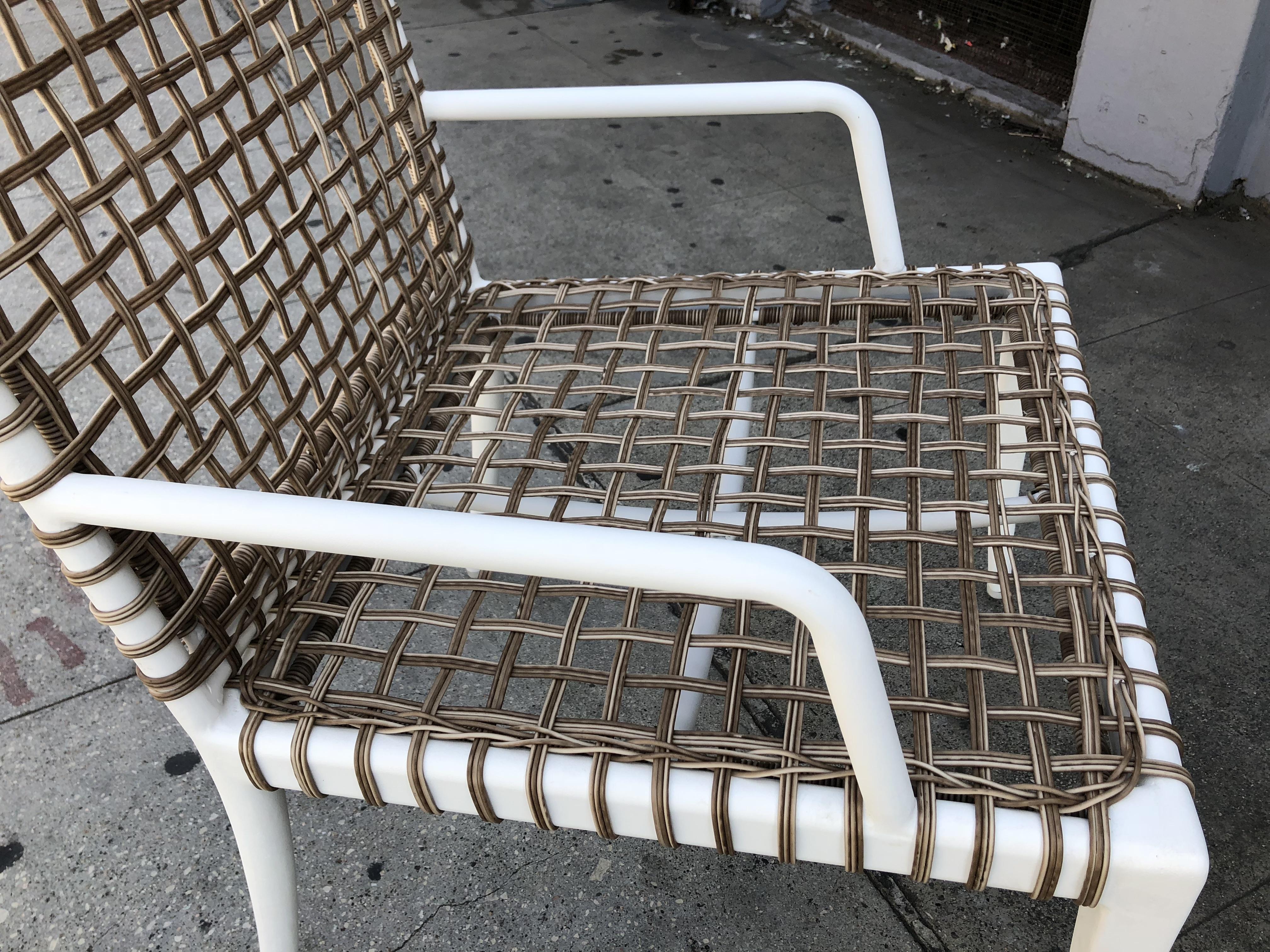 Set of 8 modern arm chairs with steel frames finished in a white powder coated finish and wicker woven seat and backrest.
The chairs are in like new condition and are ready to be used.
Measurements:
33 1/2” high x 23” wide x 25” deep
Seat with