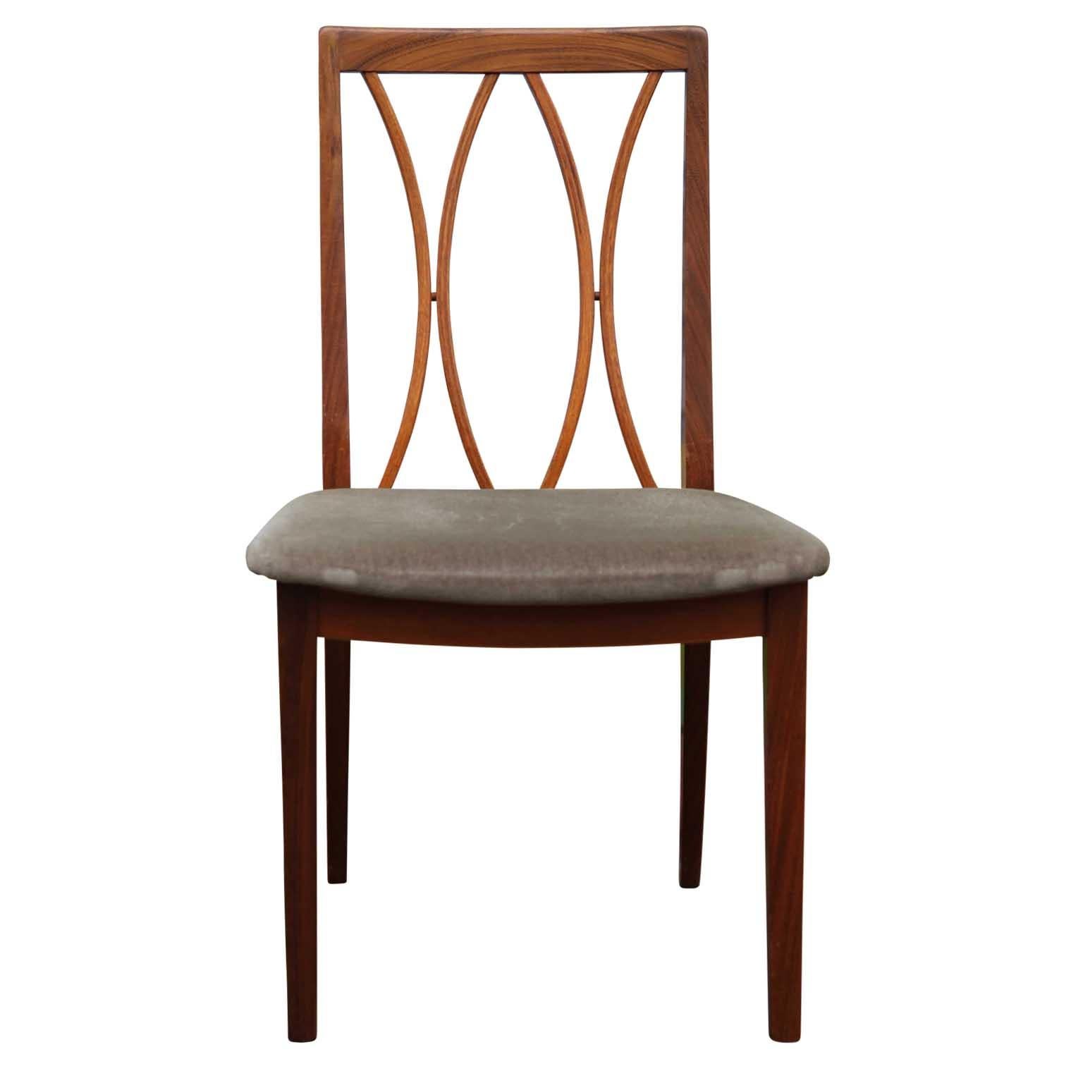 Set of 8 curve back dining chairs made by E. Gomme for G-Plan in the mid-late 20th century. The chairs are made out of afrormosia wood and have an upholstered seat. Reupholstery recommended.