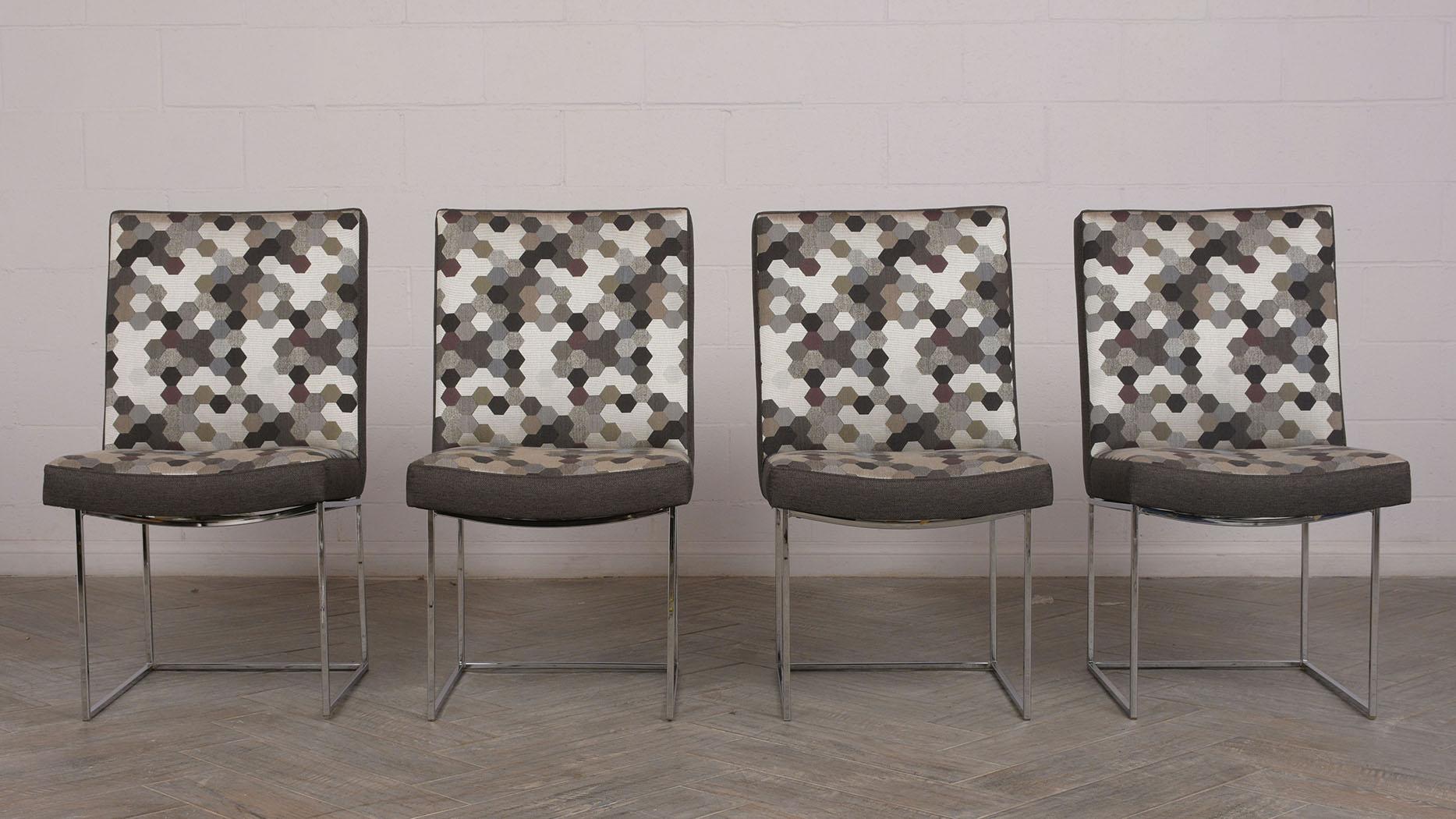 Set of 8 modern dining chairs. Chairs have a solid chrome square frame with curve seat. All chairs have been professionally reupholstered in a solid dark gray color on the back, sides, and front. The back and seat have a multicolored symmetrical