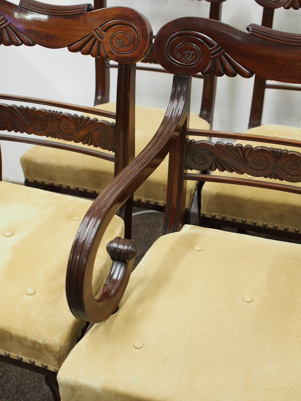 Exhibition quality set of 6 side and 2 armchairs in the style of Morrison and Co. Edinburgh, circa 1820. The chairs have a shaped carved top rail, curved shoulders and finish with a spiral carving and c scroll in the centre. There is two reeded