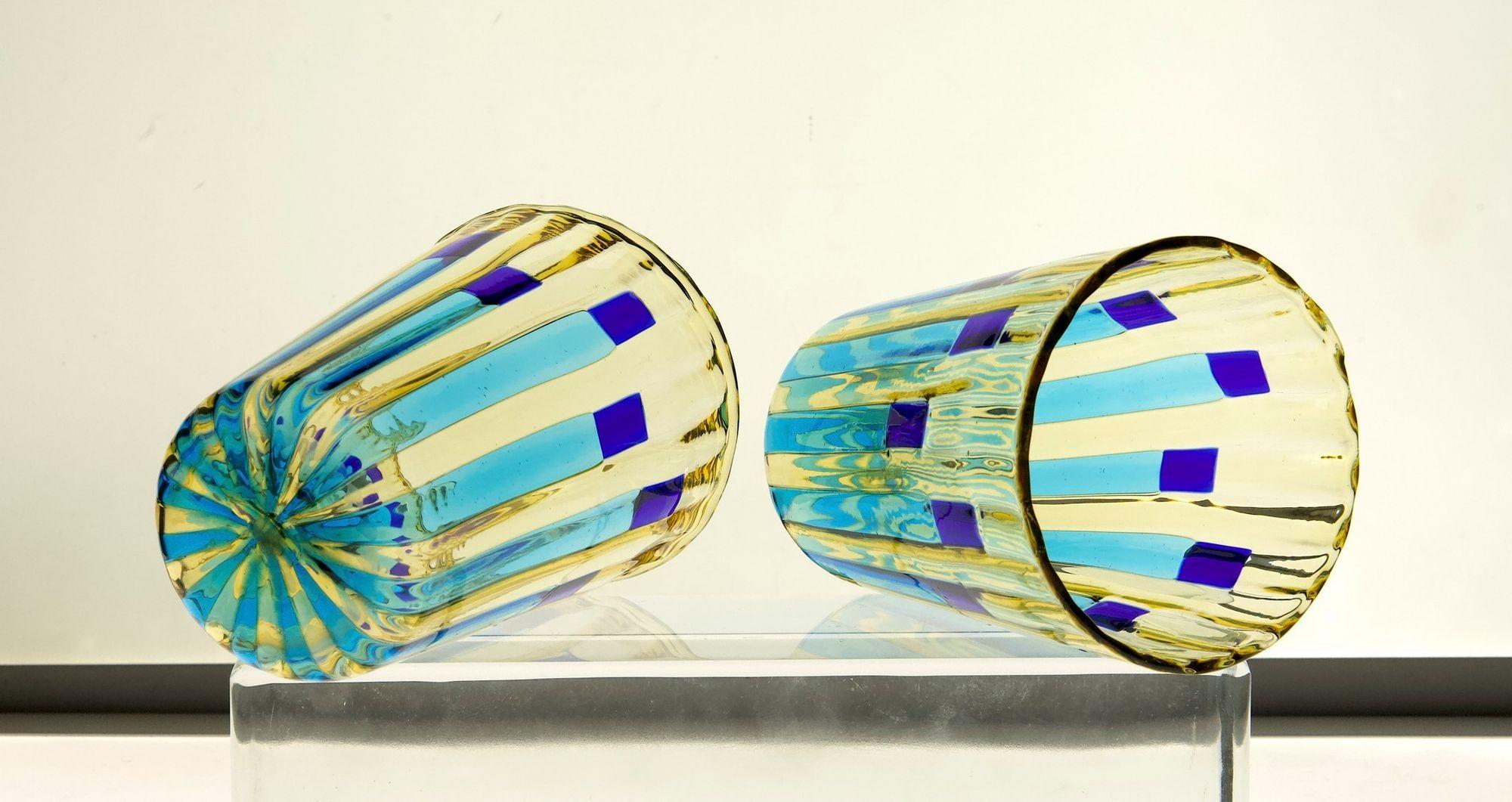Another beautiful set designed by my daughter Arianna, reconfirming the fresh and innovative approach on glass desing
She combined Murano Effetre canes of aquamarine and yellow. With cobalt blue accents. 
It's has a mix of many designers of the