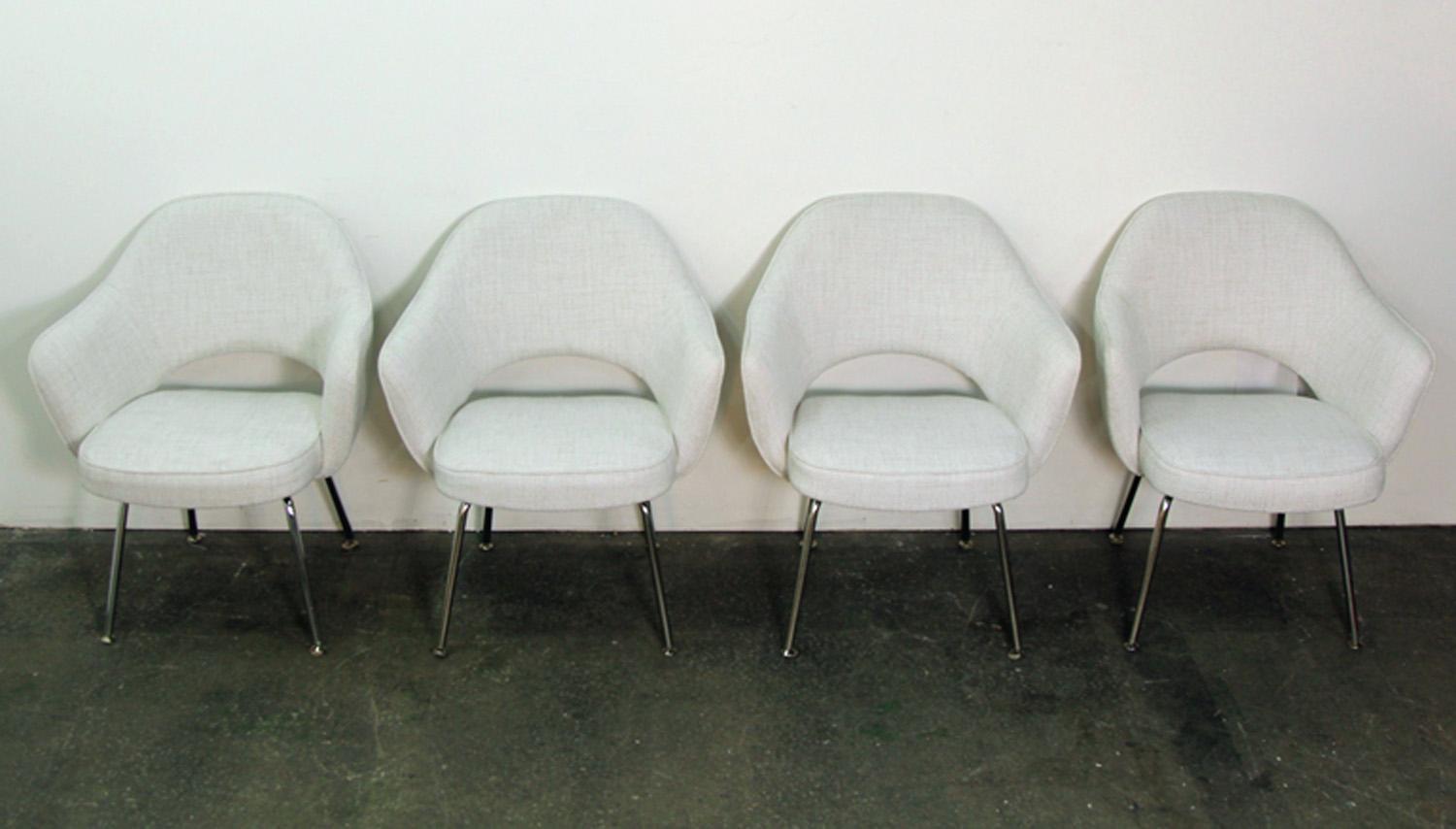 Incredible set of 8 Eero Saarinen midcentury designed executive chairs. Made by Knoll, this original set has been newly upholstered in white woven fabric. Chrome legs in excellent condition.