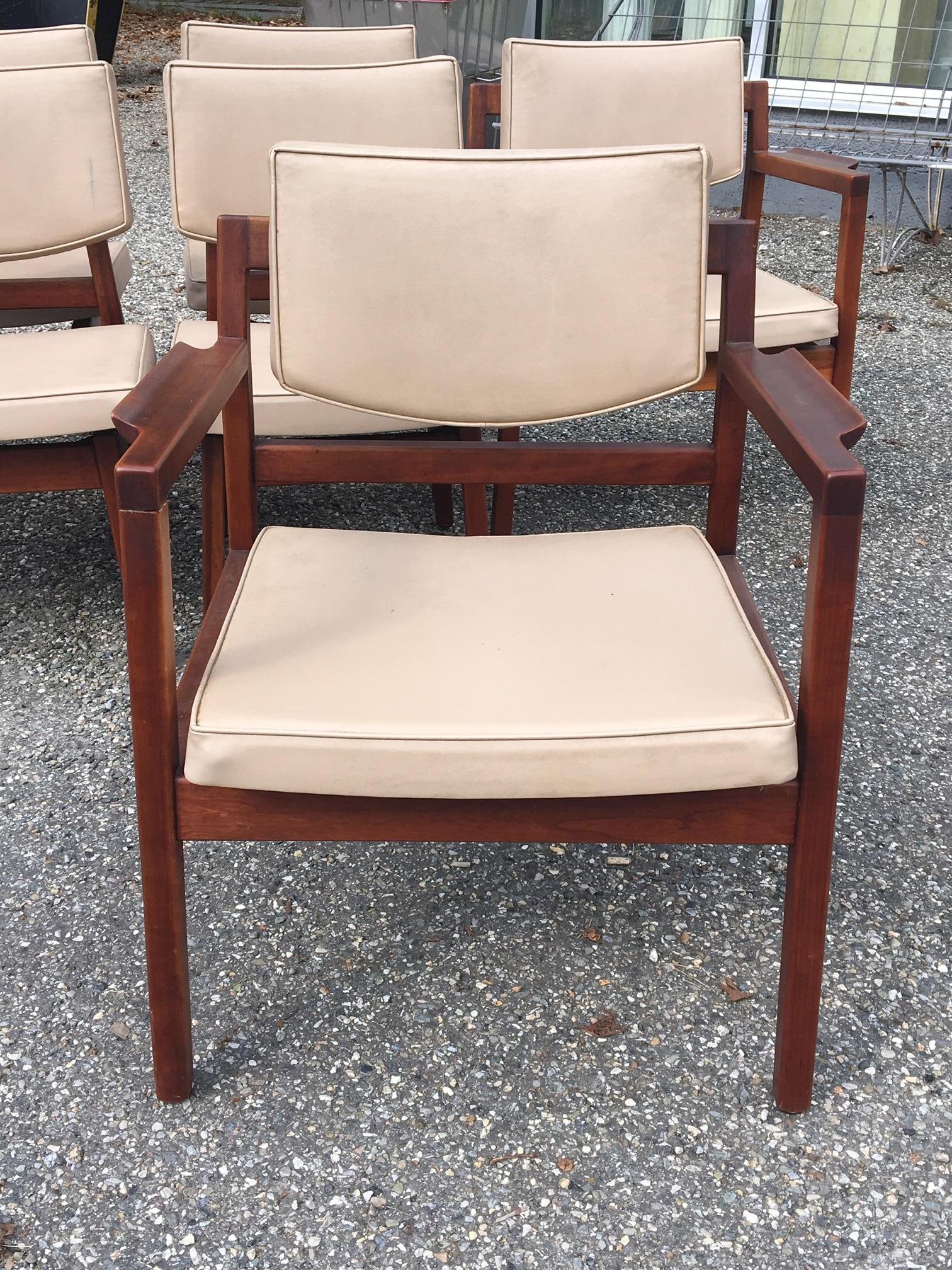 Rare set of eight (six sides and two armchairs) original Jens Risom dining chairs. Original stone color leather upholstery, original labels on each piece.

(large extension dining table, all original condition, also available)

Measurements are