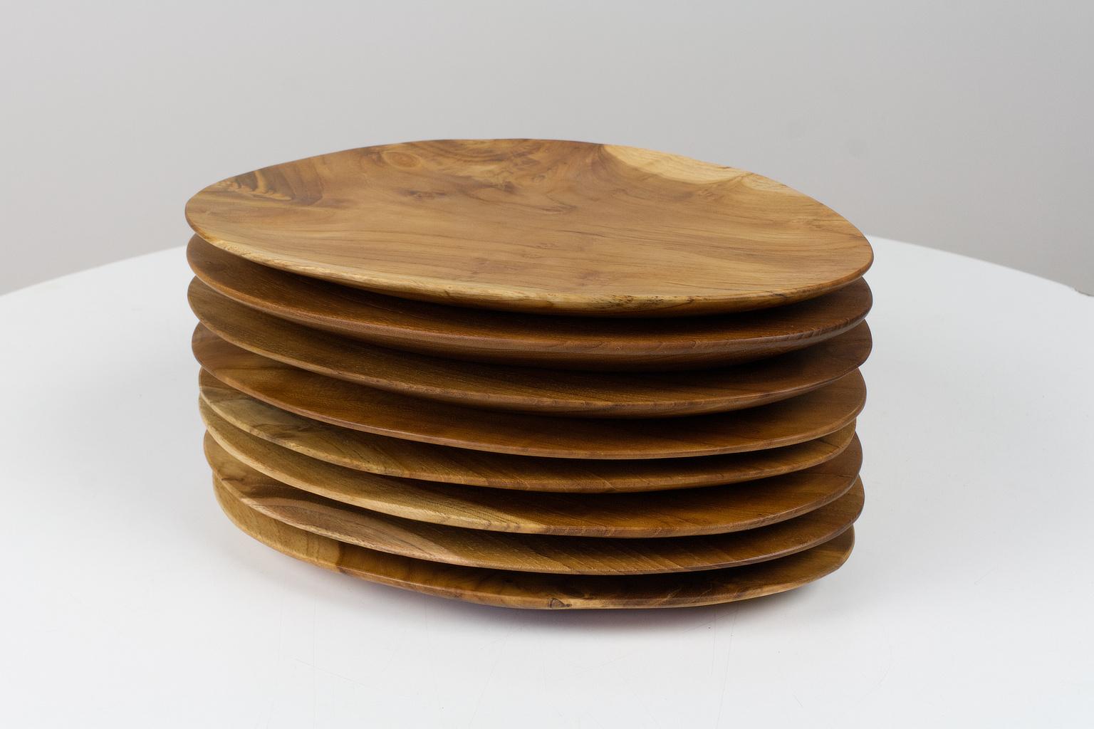 Mid-20th Century Set of 8 Oval Shaped Solid Teak Trays or Serving Plates, Hand Carved For Sale
