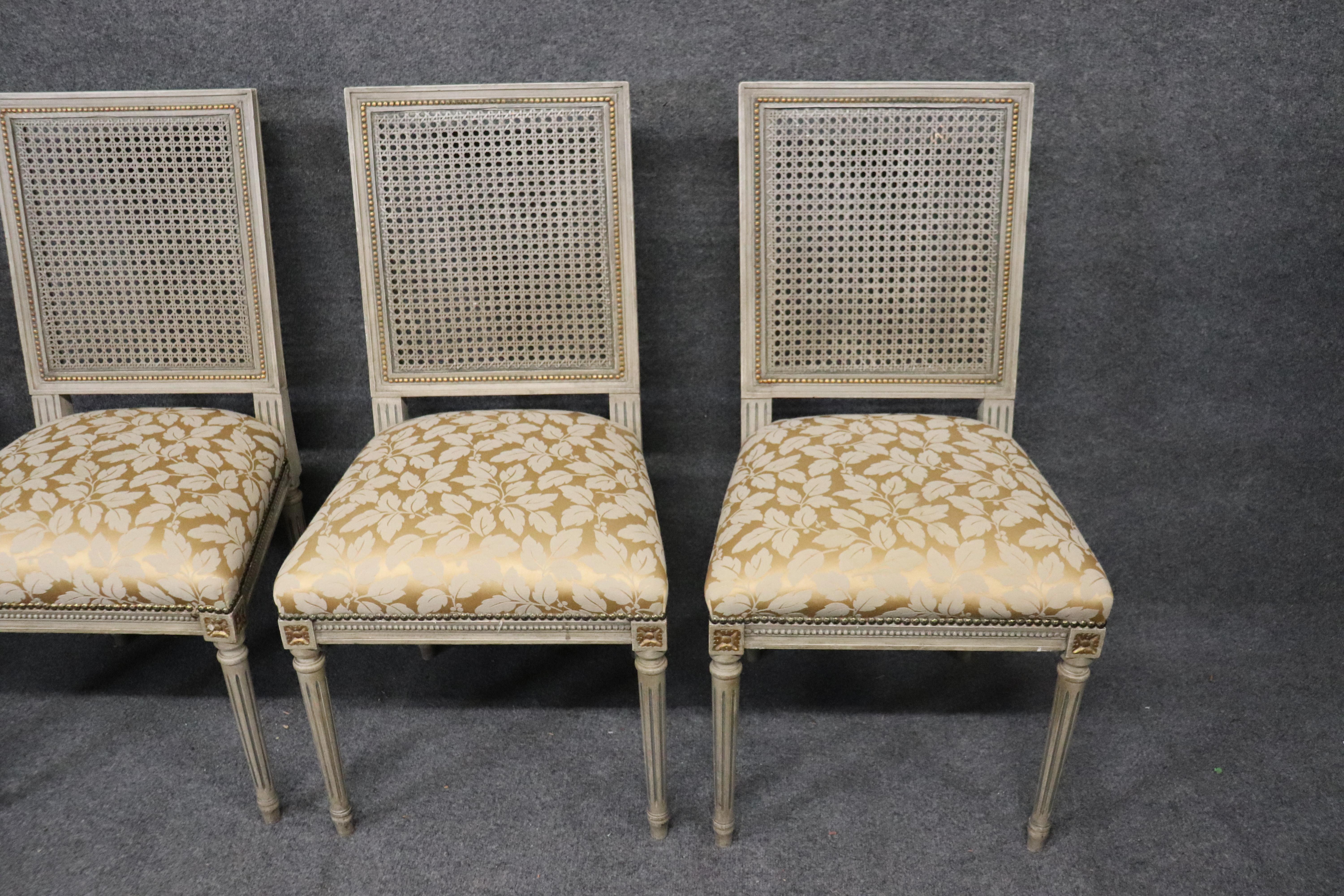Early 20th Century Set of 8 Paint Decorated French Louis XVI Cane Back Dining Chairs, circa 1920s