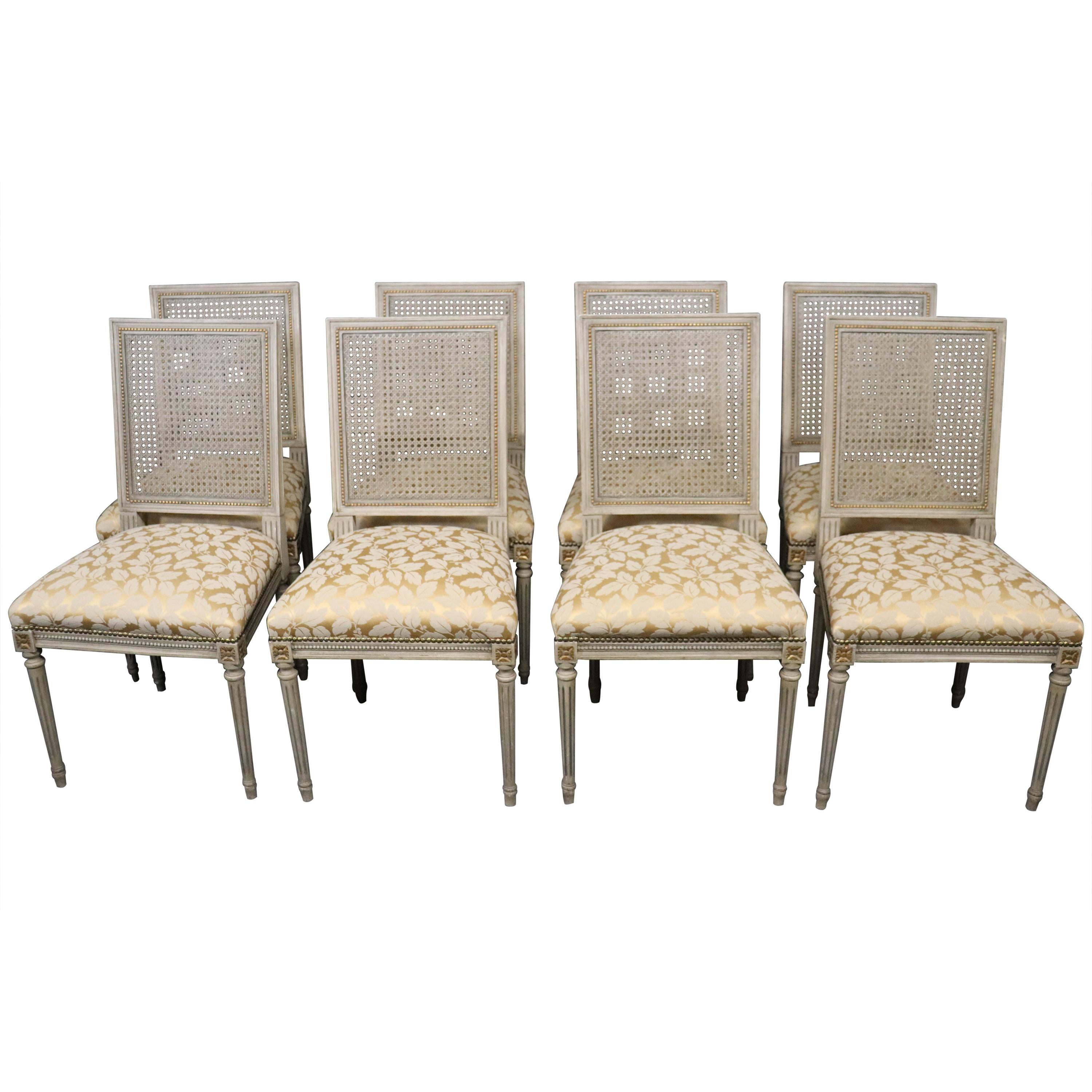 Set of 8 Paint Decorated French Louis XVI Cane Back Dining Chairs, circa 1920s