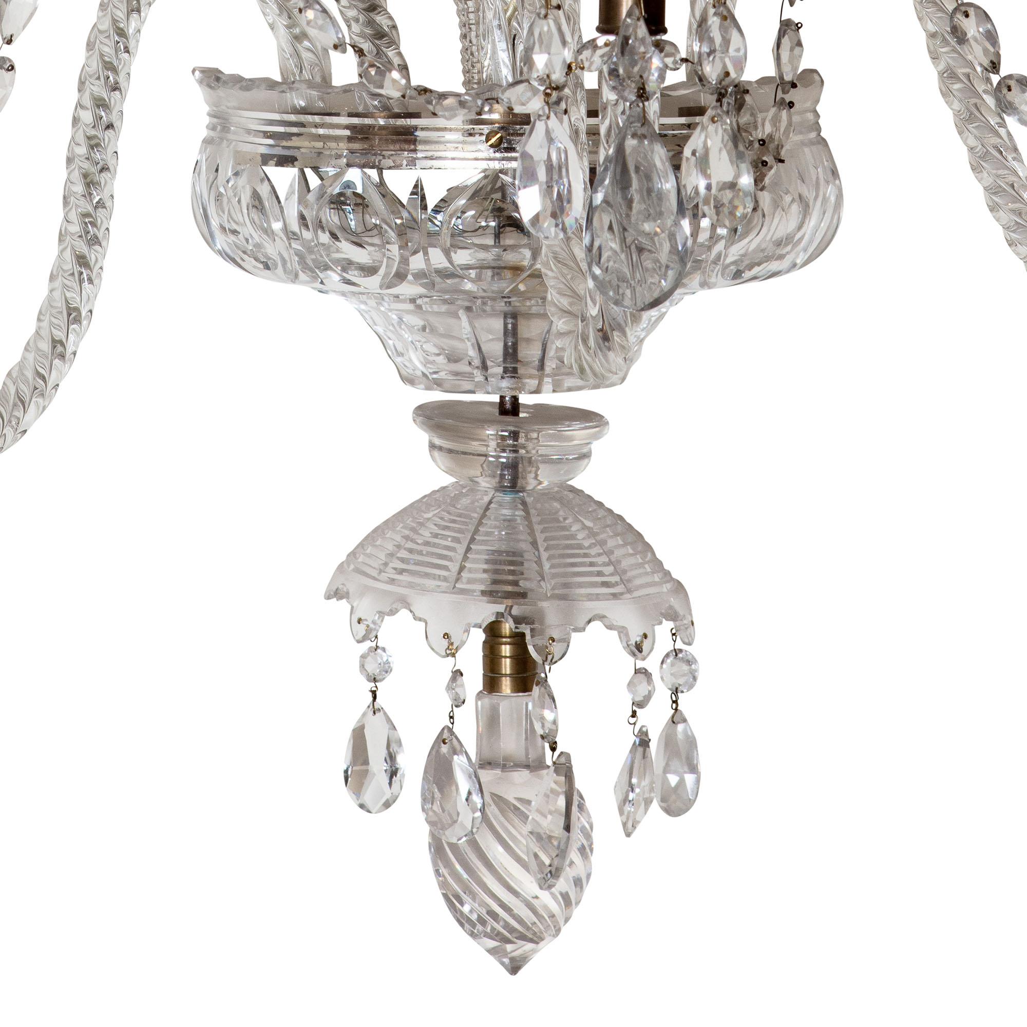 A rare set of 8 Palatial 19th century cut glass wall lights, each with five-light in two tiers. Eight pointed stars surmount scrolled coronas hung with cut pear drops, five arms issue from a central receiving plate with Van Dyck drip pans, and