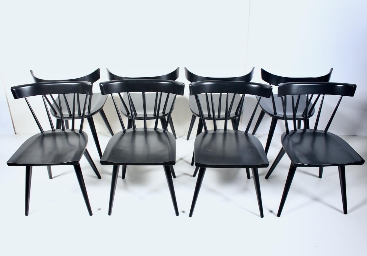 Set of 10 Paul McCobb for Winchendon Black enameled Birch Dining Side Chairs. Featuring well balanced ergonomic solid Birch (Model 1531) spindle forms, satin Black enameled finish, wide seats, arched back, atop sturdy flared legs. Classic. American